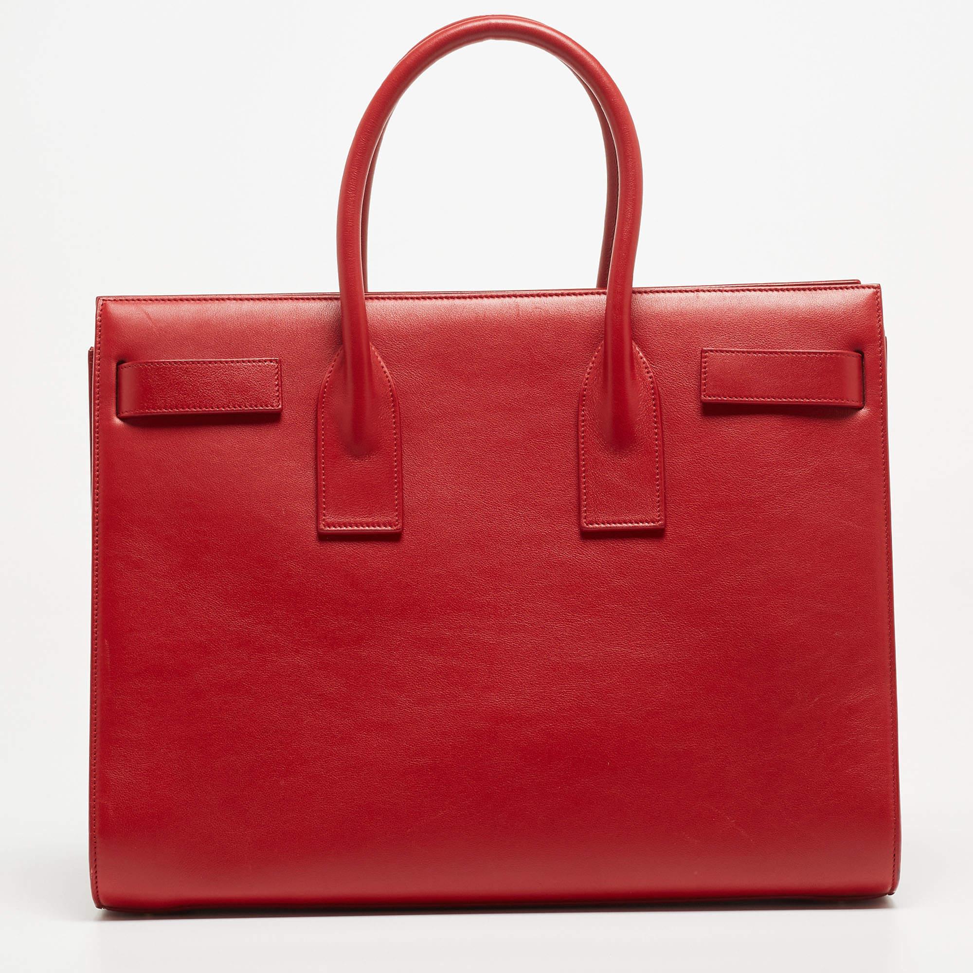 Handbags are more than just instruments to carry one's essentials. They essay one's sense of style, and the better the bag, the more confidence we get when we hold it. This Saint Laurent red bag is meticulously made from luxe materials and has a