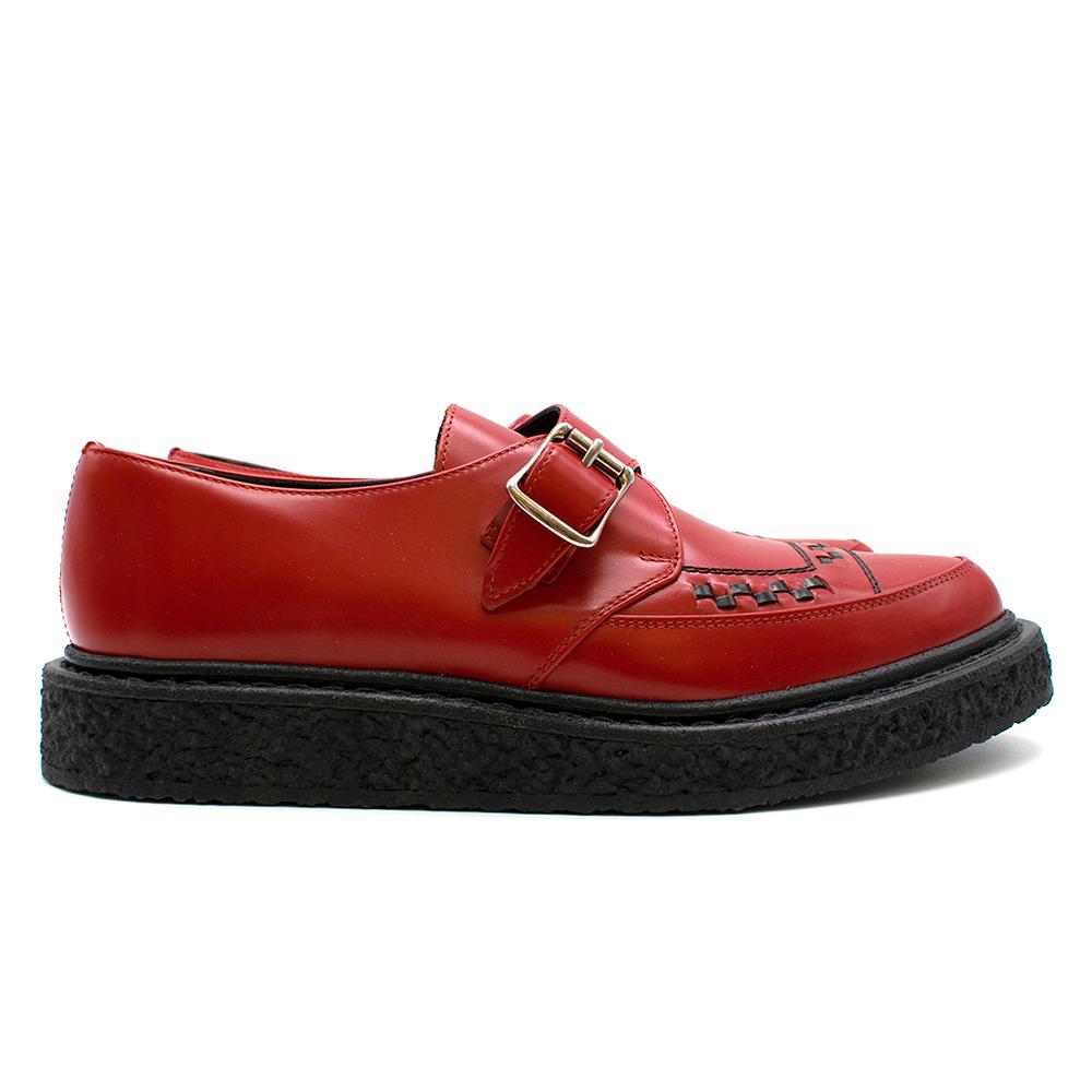 Saint Laurent Red Leather Monk Buckle Creepers with pointed toe featuring woven detailing and contrast stitching at toe in black and adjustable monk strap with pin a buckle. RRP £750

​Please note, these items are pre-owned and may show signs of