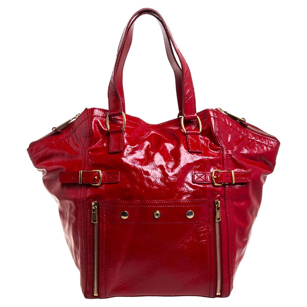 Every woman needs a bag that is pretty and functional, just like this Downtown tote from Saint Laurent. Crafted with precision using patent leather, the red bag has been styled with zippers and buckles. It also features two handles, and a top which