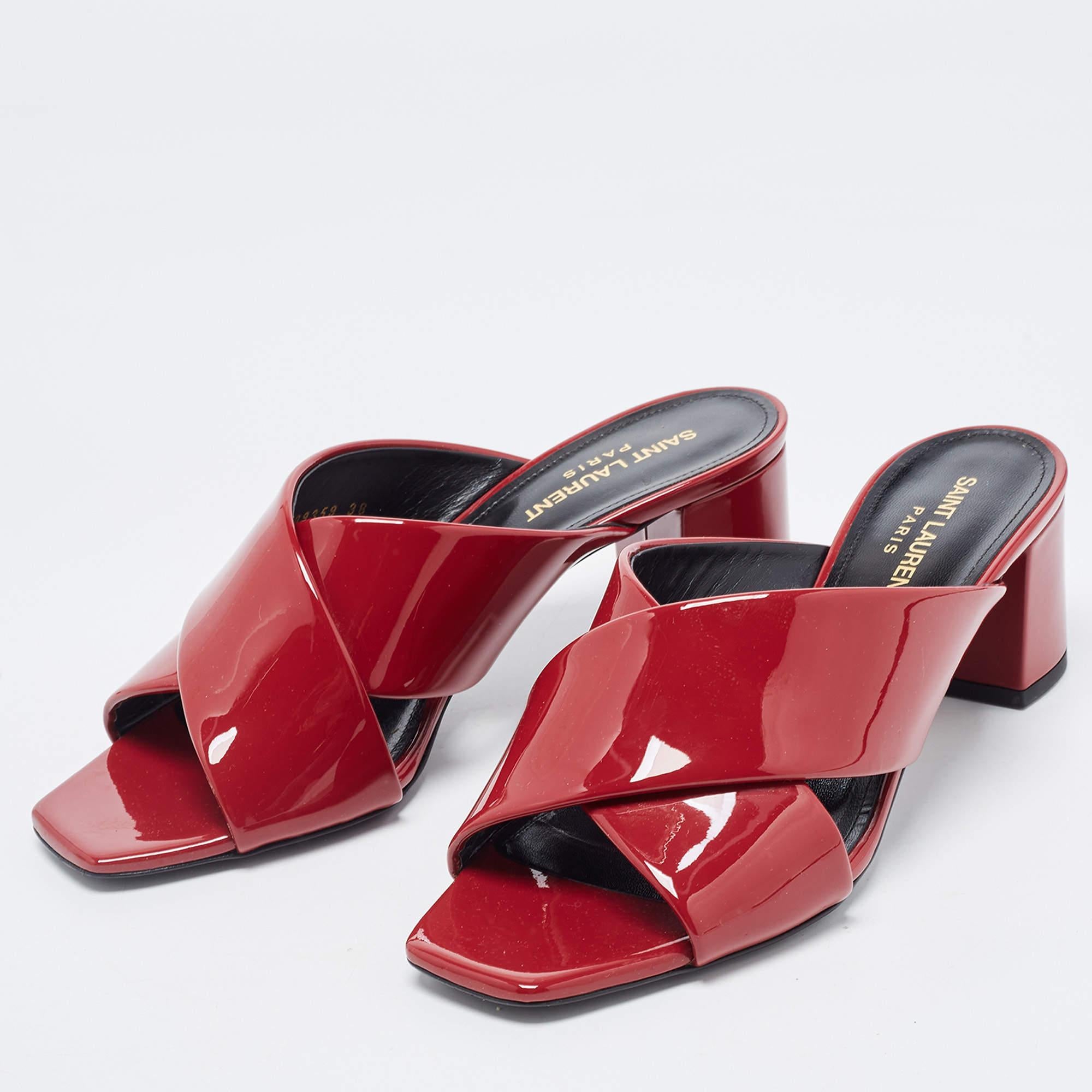 Stylish, sleek & sophisticated, these sandals by Saint Laurent will make sure you are ready for the day and night. Crafted meticulously from glossy patent leather, these Loulou sandals have open toes, criss-cross straps, block heels, and durable