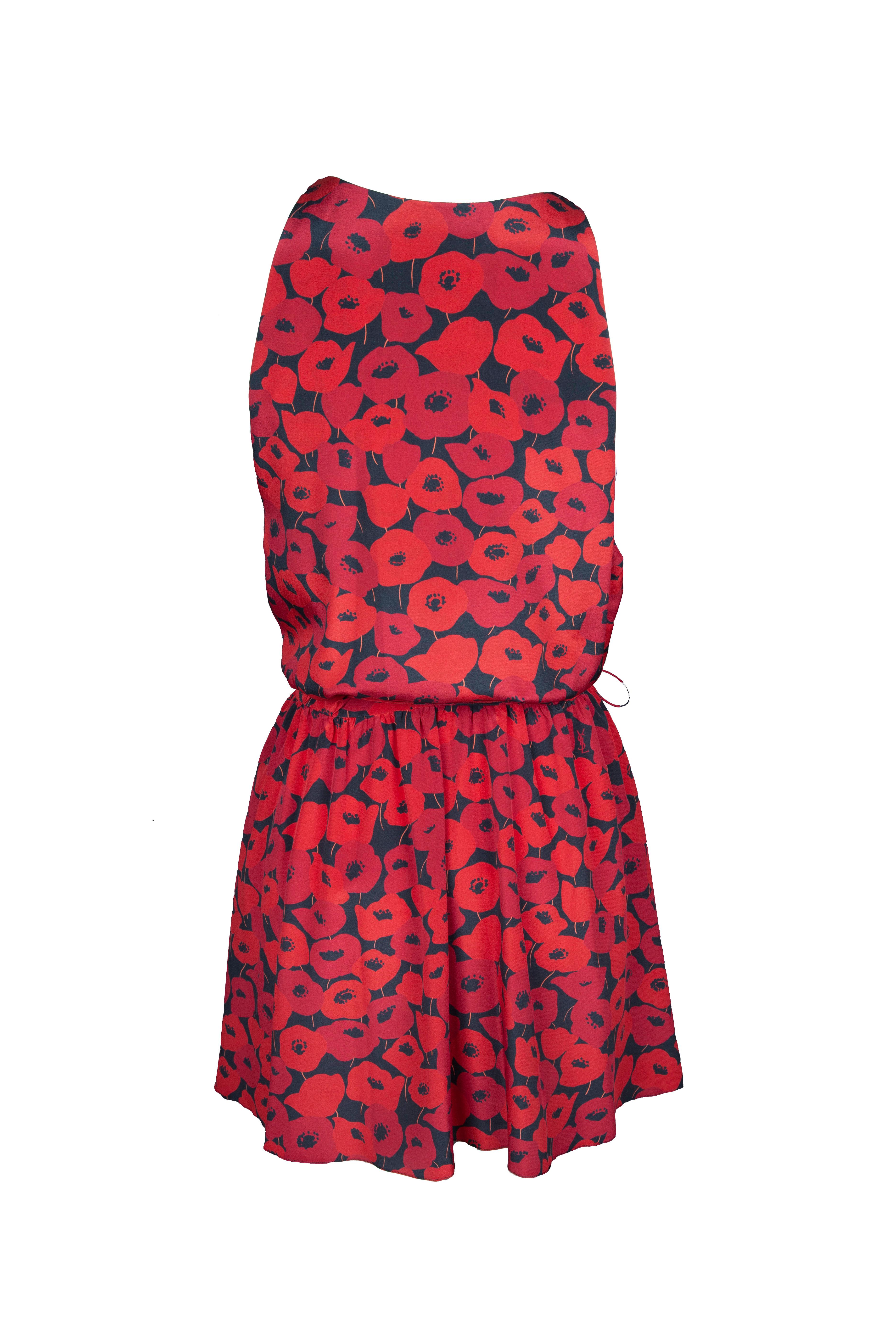 This Saint Laurent Resort 2018 red floral print mini dress features a flattering wrap silhouette and adjustable skinny ties to customize the fit. The light weight, non stretchy fabric is an ideal choice for a warm summer day, or choose to pair it