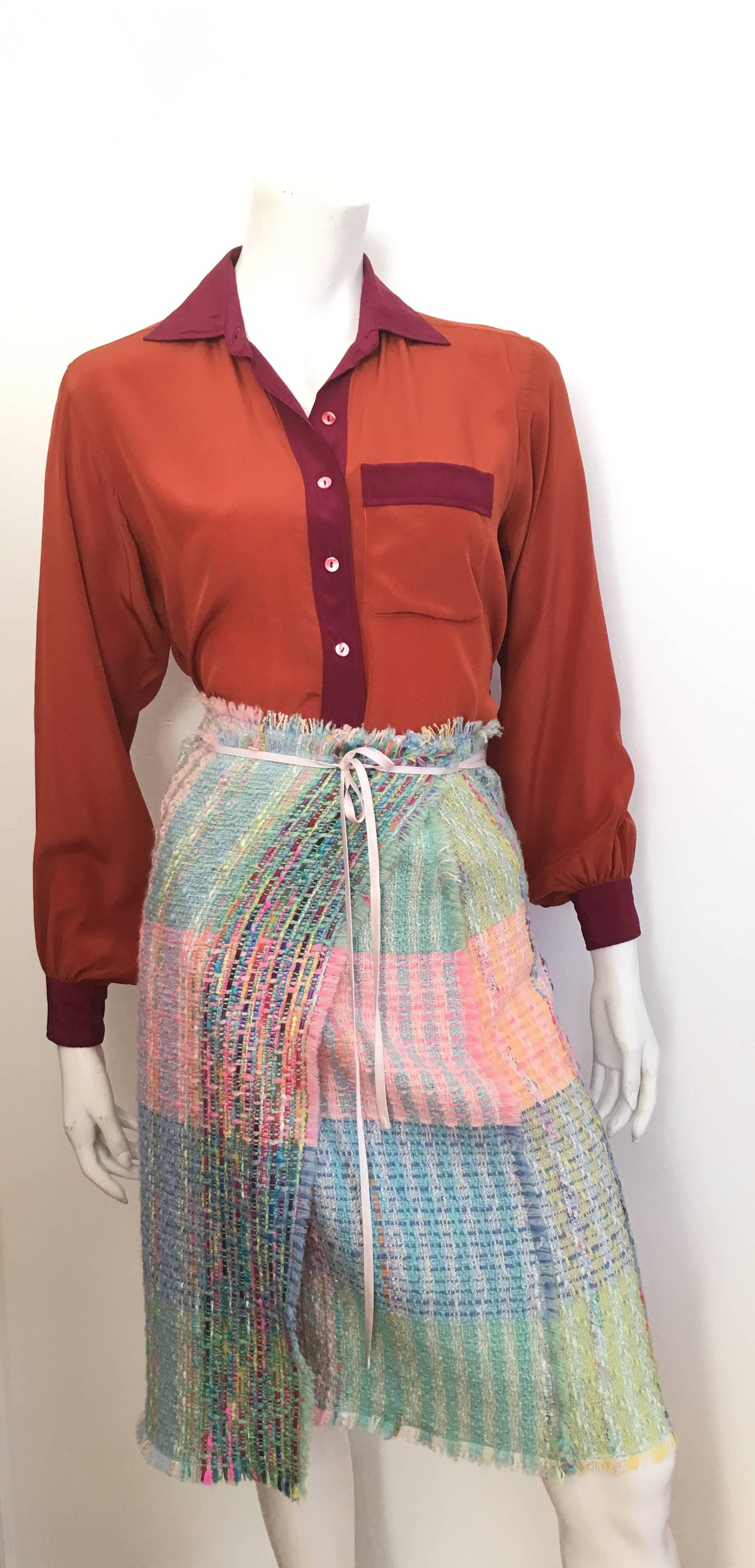 Yves Saint Laurent for Saint Laurent Rive Gauche 1970s rust brown with purple trim silk blouse will fit a size 4. This YSL silk blouse is a classic & timeless design that looks amazing today as when it was first created. Wear this YSL blouse with