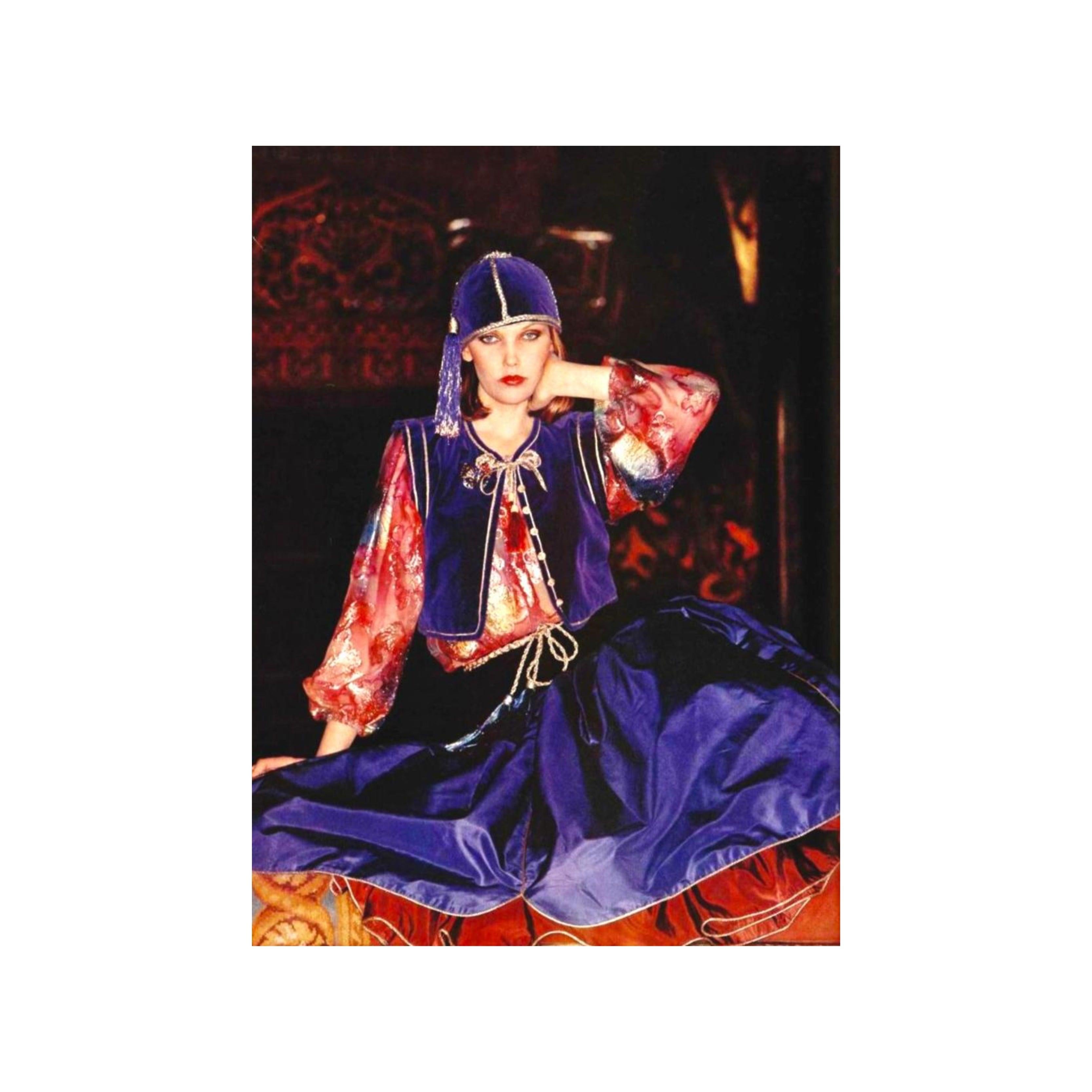 Get ready to make a statement with this Yves Saint Laurent Vest and Skirt Set from the iconic 1976 Russian Ballet collection. Made from a luxurious cotton and viscose blend, this set features a rich purple velvet fabric and exquisite golden