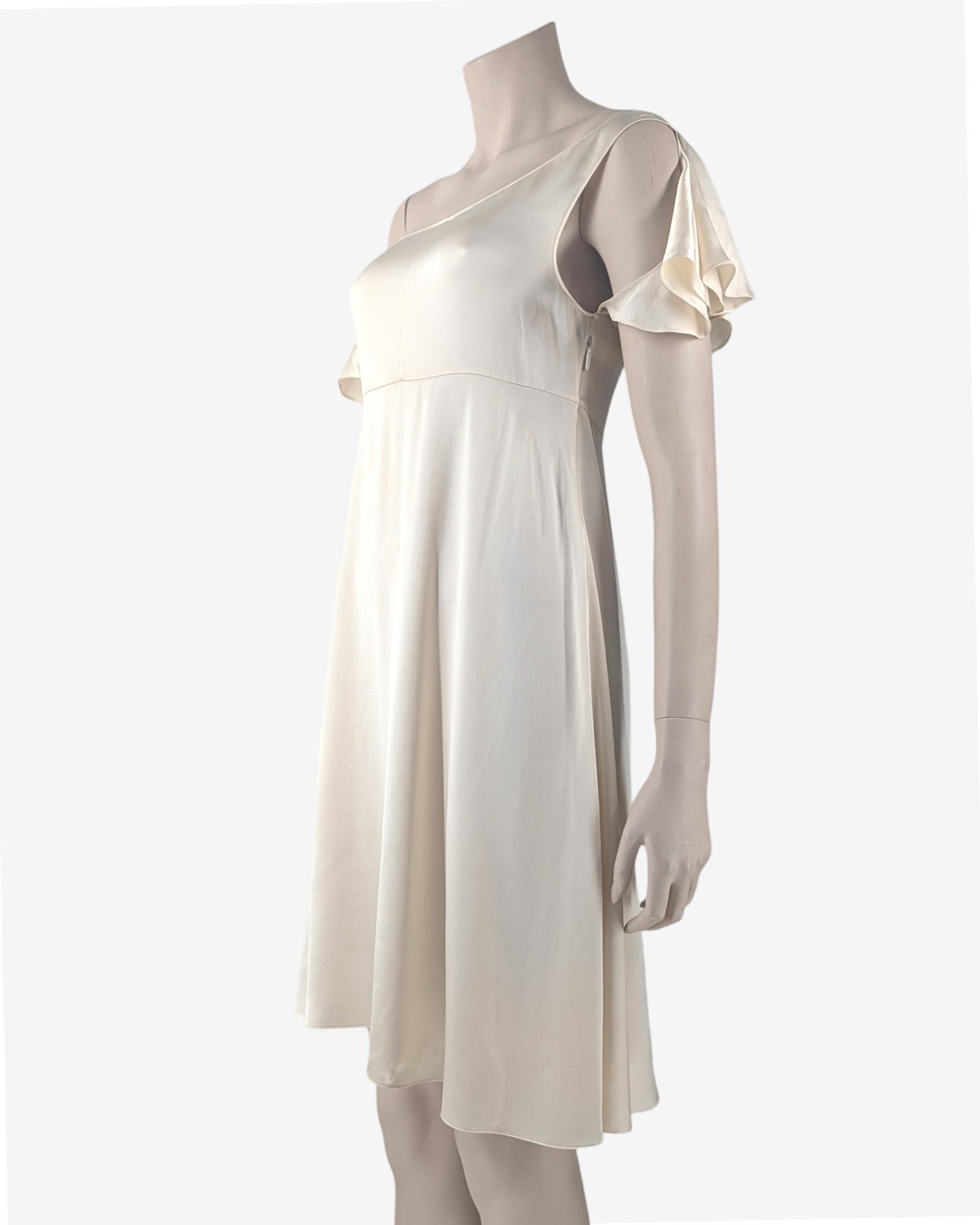 Pearl draped asymmetric dress Saint Laurent by Hedi Slimane  from the Spring Summer 2016 collection.

. Extremely Soft Silk fabric
. Boat neckline with cut out sleeve on one side
. Zip on the side

Fits S, small M
Flat measurements : 

Breast : 37