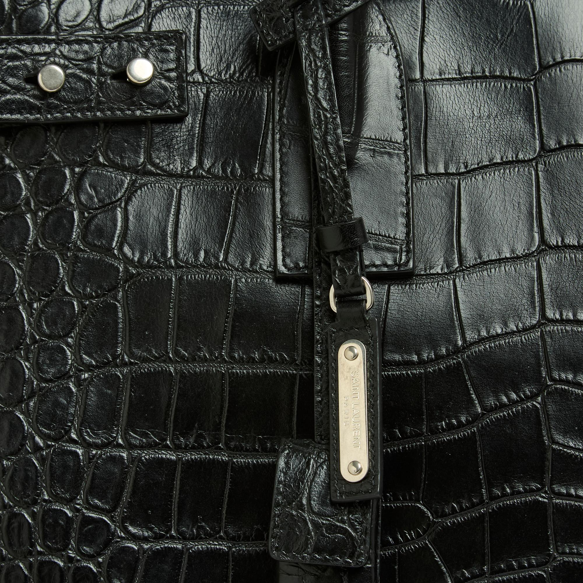 Saint Laurent bag Sac de Jour series North/South model in soft black crocodile embossed leather, black leather interior with 2 patch pockets and a zipped pocket, bag closure with a large zip, padlock, keys, pull tab and bell, 2 high handles for
