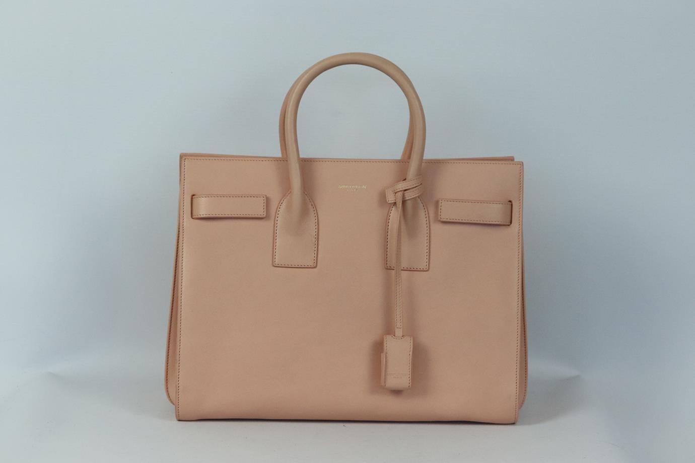 Saint Laurent Sac du Jour medium leather tote bag. Pink. Open top. Does not come with dustbag or box. Height: 9.6 in. Width: 12.5 in. Depth: 6.5 in. Handle Drop: 3.5 in. Strap Drop: 19.2 in. Very good condition - Few scuff marks to base. One light