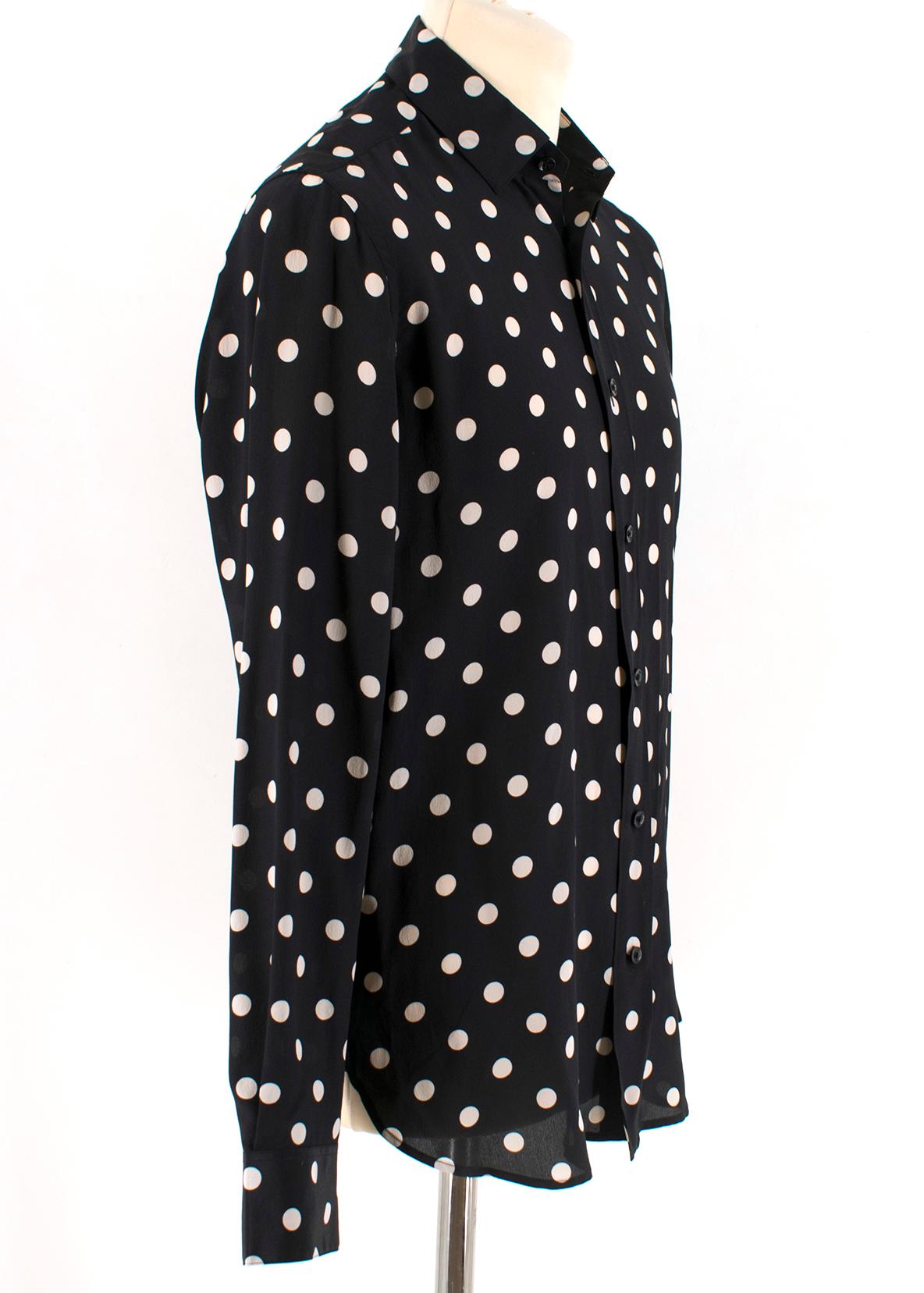 Saint Laurent Silk Polka Dot Shirt 

Long sleeve button front shirt 
Pointed collar
Polka dot print
Straight shoulders
Single button mitered cuff
Double pleat on sleeve placket

Please note, these items are pre-owned and may show some signs of