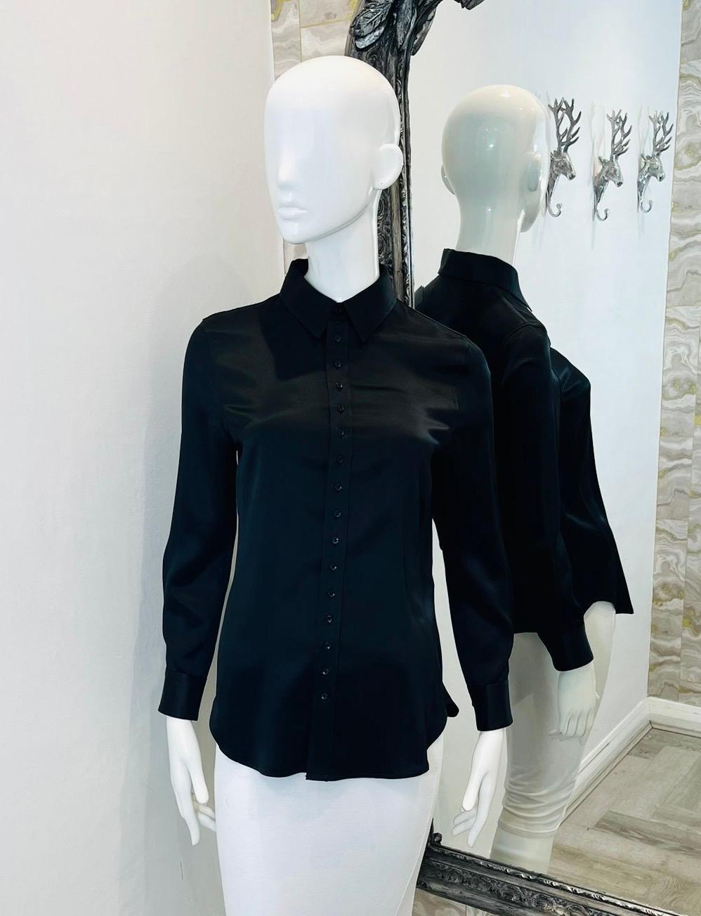 Saint Laurent Silk Shirt

Black shirt crafted from fluid silk-satin.

Featuring classic fit, classic collar and centre button fastening. Rrp £1015

Size – 38FR

Condition – Excellent

Composition – 100% Silk