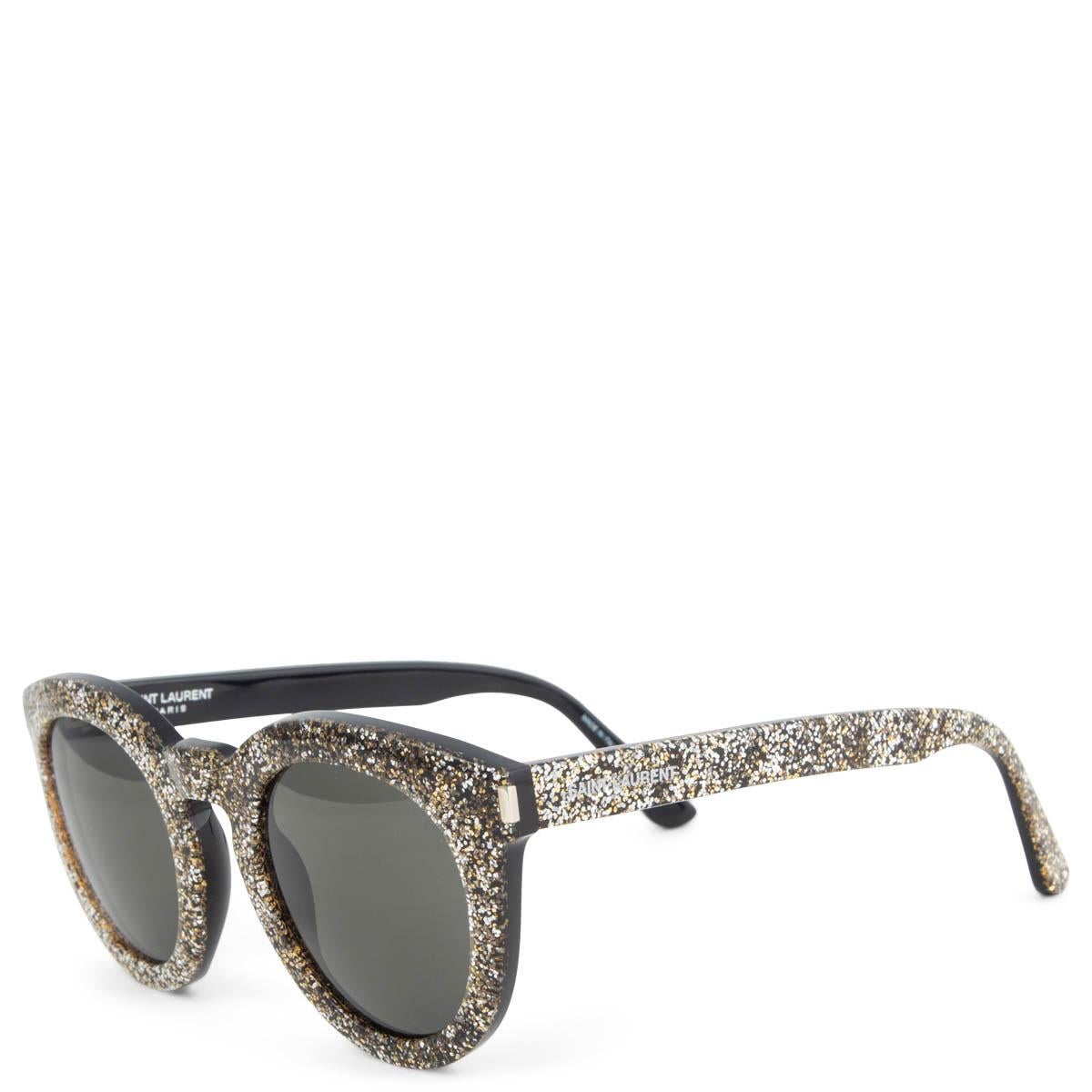 100% authentic Saint Laurent SL102 003 silver & gold glitter sunglasses in acetate with grey lenses. Have been worn and are in excellent condition. Come with case. 

Measurements
Model	SL102 003
Width	13.5cm (5.3in)
Height	5.3cm (2.1in)

All our