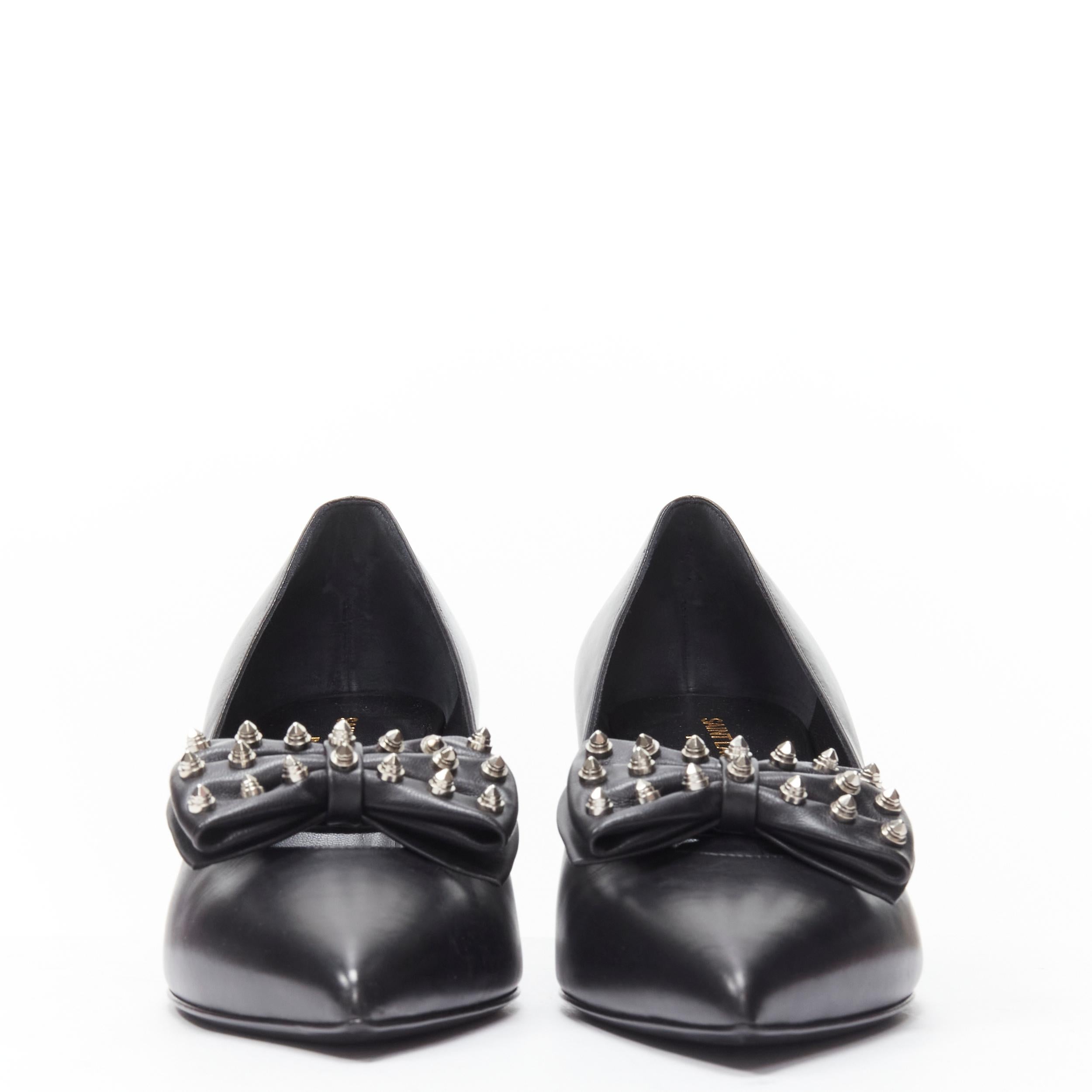 SAINT LAURENT silver spike studded bow point toe pump EU37 
Reference: MELK/A00207 
Brand: Saint Laurent 
Material: Leather 
Color: Black 
Pattern: Solid
Made in: Italy 

CONDITION: 
Condition: Excellent, this item was pre-owned and is in excellent