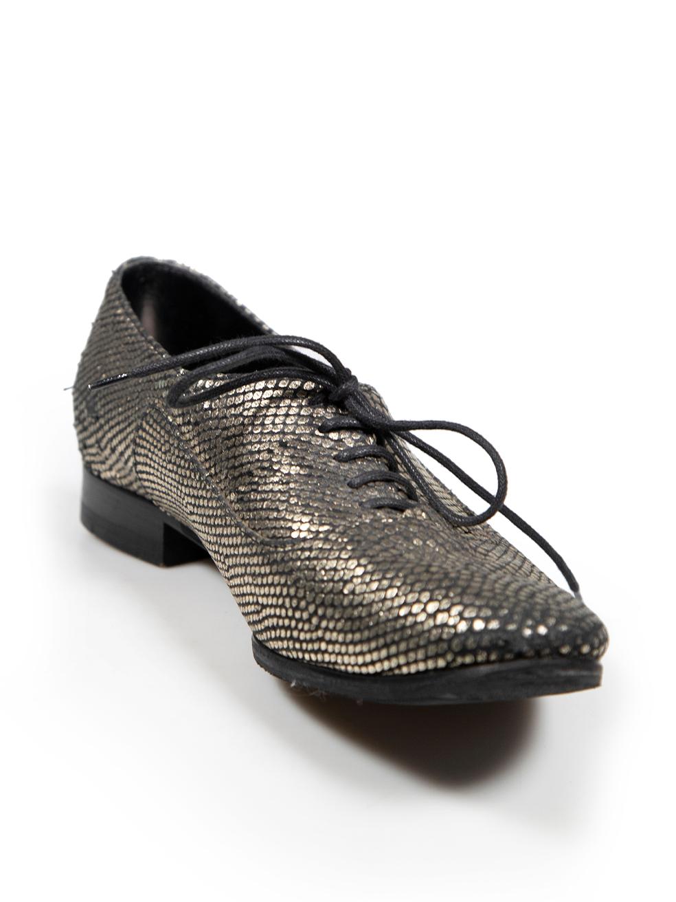 CONDITION is Good. Minor wear to shoes is evident. Light abrasion to heel seam, soles, inside back of shoe and toe edge on this used Saint Laurent designer resale item. These shoes have been resoled.
 
 Details
 Silver
 Suede
 Oxfords
 Snakeskin