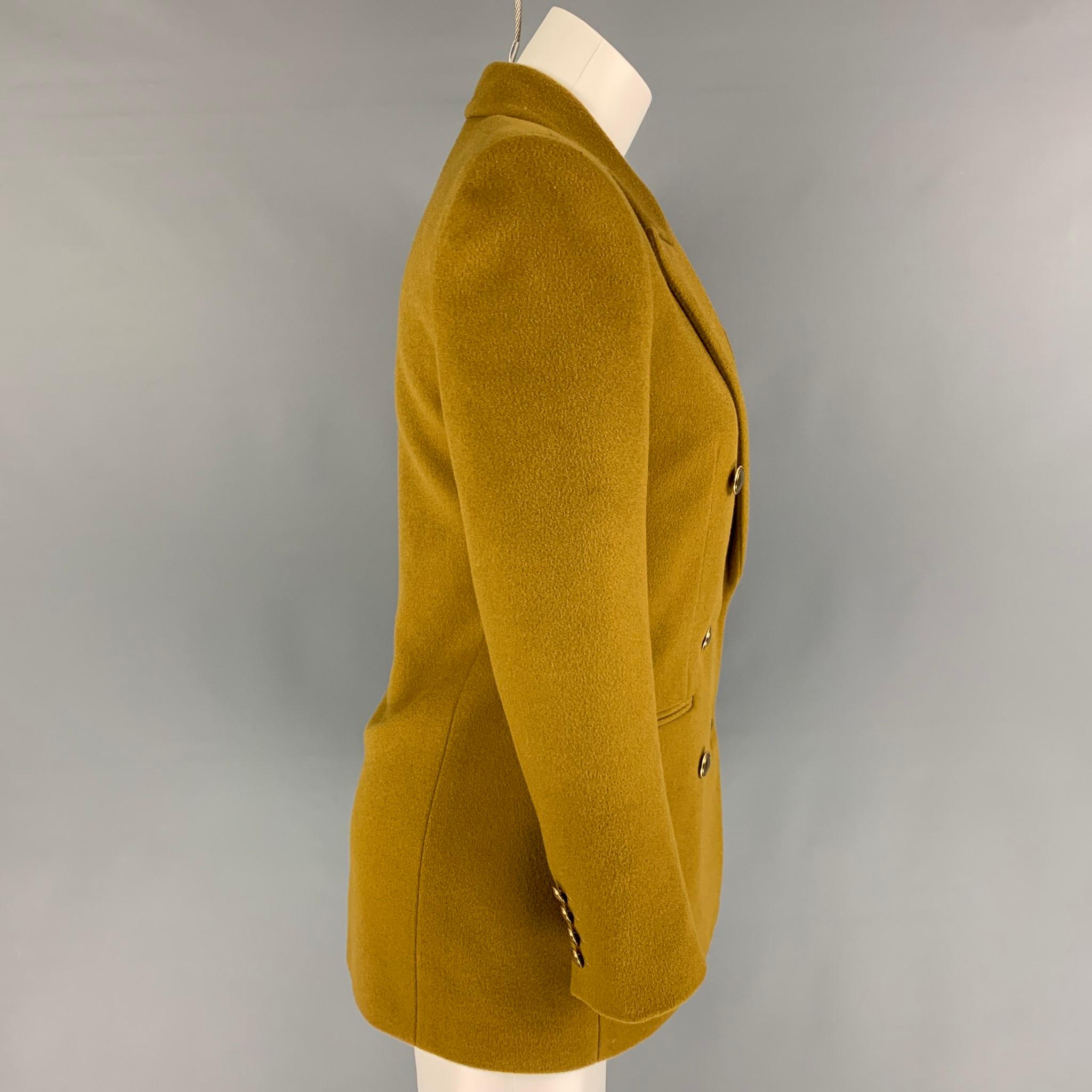 SAINT LAURENT 2020 jacket comes in a mustard wool / cashmere with a silk lining featuring a peak lapel, gold tone button details, slit pockets, and a double breasted closure. Made in Italy. 

Very Good Pre-Owned Condition.
Marked: F36
Original