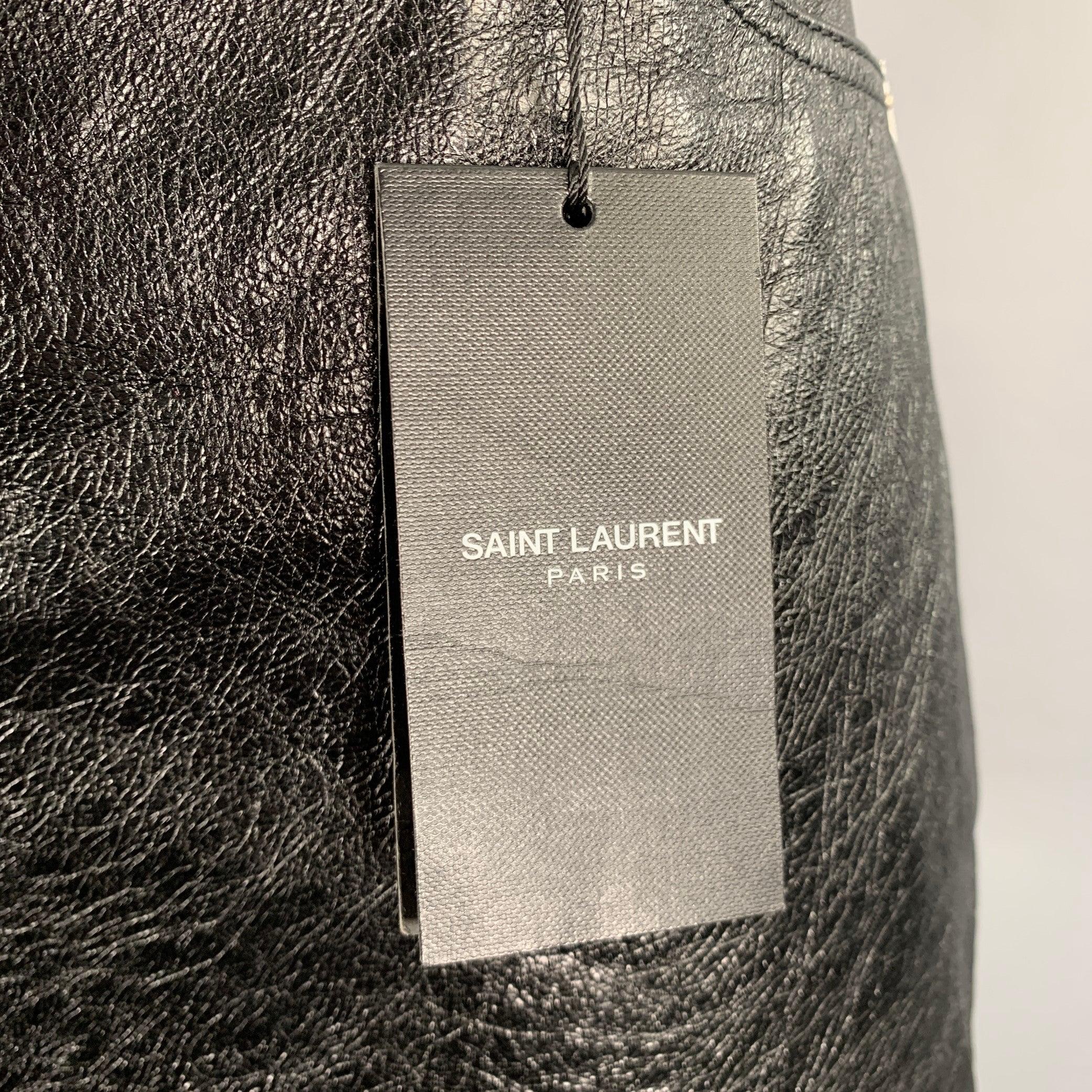 SAINT LAURENT skirt
in a black calfskin leather featuring a mini length, five pockets, and zip fly closure. Made in Italy.New with Tags. 

Marked:   F42 

Measurements: 
  Waist: 33 inches Hip: 40 inches Length: 15 inches 
  
  
 
Sui Generis
