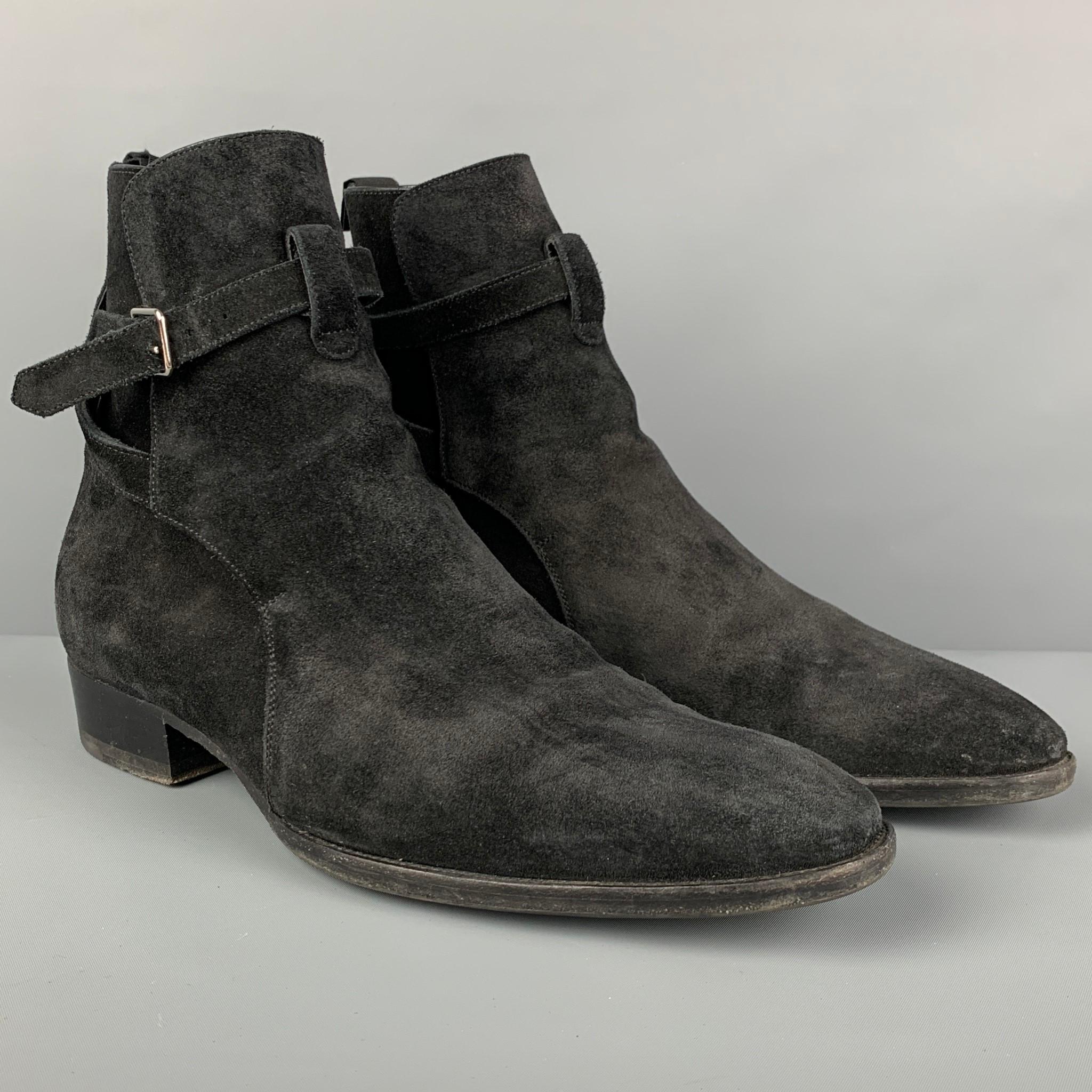 SAINT LAUREN 'WYATT 30 JODHPUR' boots comes in a black suede featuring a round toe, pull on style, and a crisscross adjustable strap. Includes box.

Very Good Pre-Owned Condition.
Marked: 43
Original Retail Price: $1,150.00

Measurements:

Length: