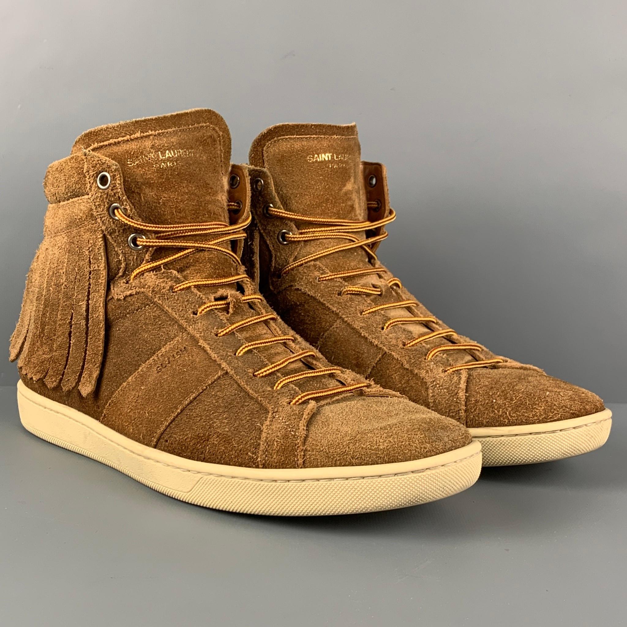 SAINT LAURENT 'SL/18H' sneakers comes in a tan suede featuring a high top style, fringe trim design, and a lace up closure. Made in Italy. 

Very Good Pre-Owned Condition.
Marked: 43

Outsole: 11.5 in. x 4 in. 