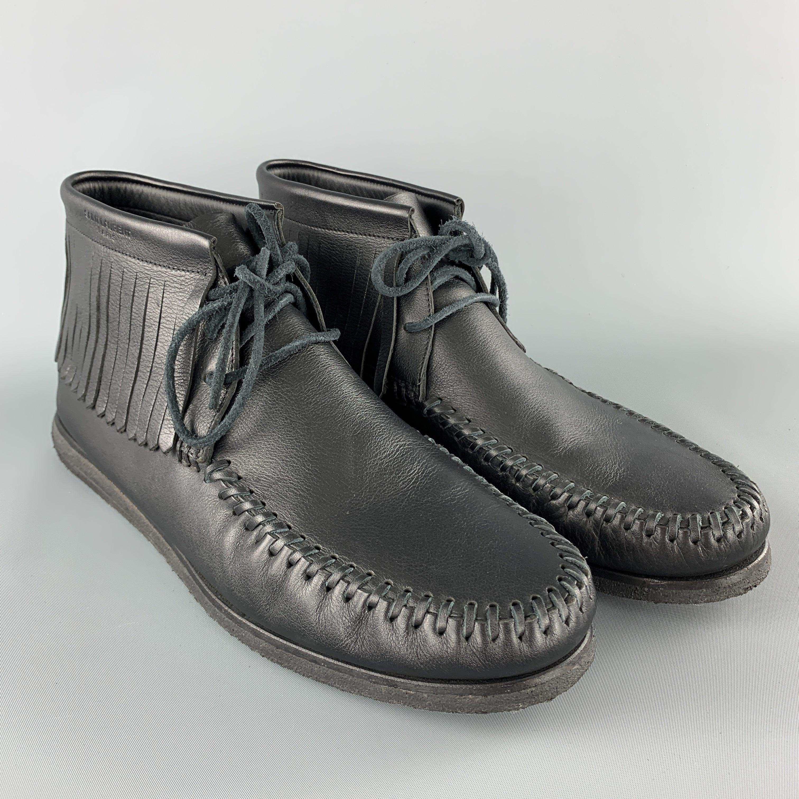 SAINT LAURENT Moccasin inspired sneakers come in smooth black leather with a whipstitch apron toe, suede laces, fringe trim, and crepe sole. With box. Made in Italy.Excellent
Pre-Owned Condition. 

Marked:   IT 45 

Measurements: 
  Outsole: 11.75 x