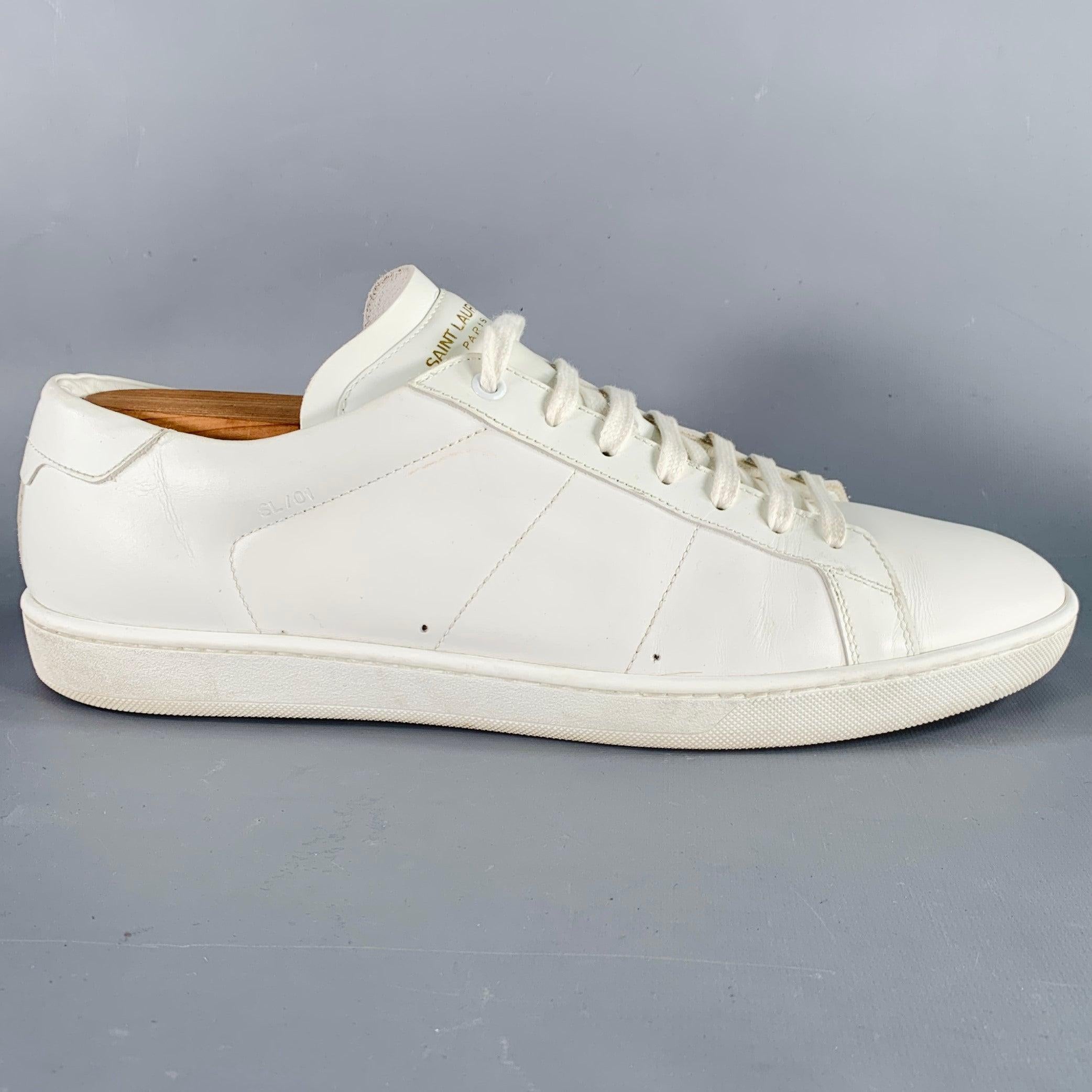 SAINT LAURENT sneakers
in a white leather featuring a low top style, rubber sole, and lace-up closure. Shoe trees not included. Made in Italy.Very Good Pre-Owned Condition. Minor marks, signs of wear on soles. 

Marked:   M 315485 45Outsole:12