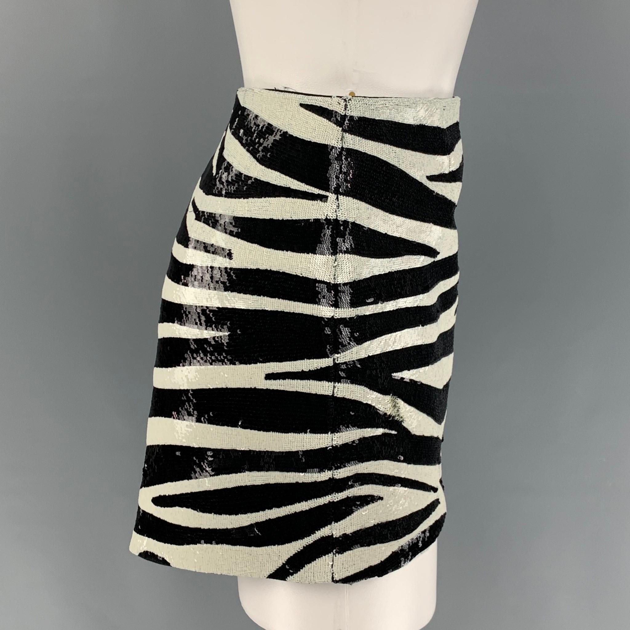 SAINT LAURENT mini skirt comes in a black & white zebra print acetate / viscose featuring an asymmetrical hem and a hidden zip up closure. Made in Italy. 

Excellent Pre-Owned Condition.
Marked: F 38
Original Retail Price: