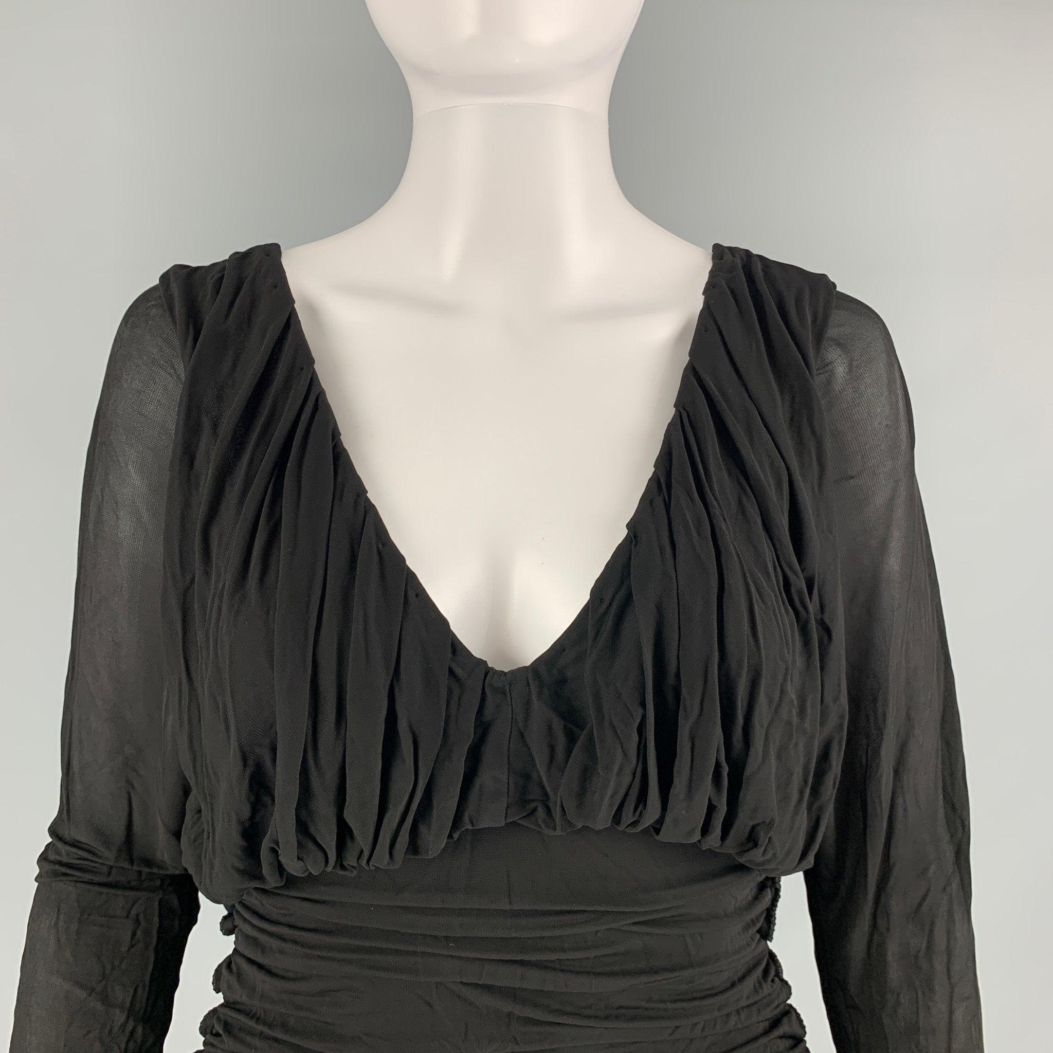 SAINT LAURENT cocktail dress comes in a black cupro material featuring long sleeve, ruched style, and an open back. New with Tags. 

Marked:  34 

Measurements: 
 
Shoulder: 16 inches Bust: 30 inches Waist: 22 inches Hip: 34 inches Sleeve: 26 inches