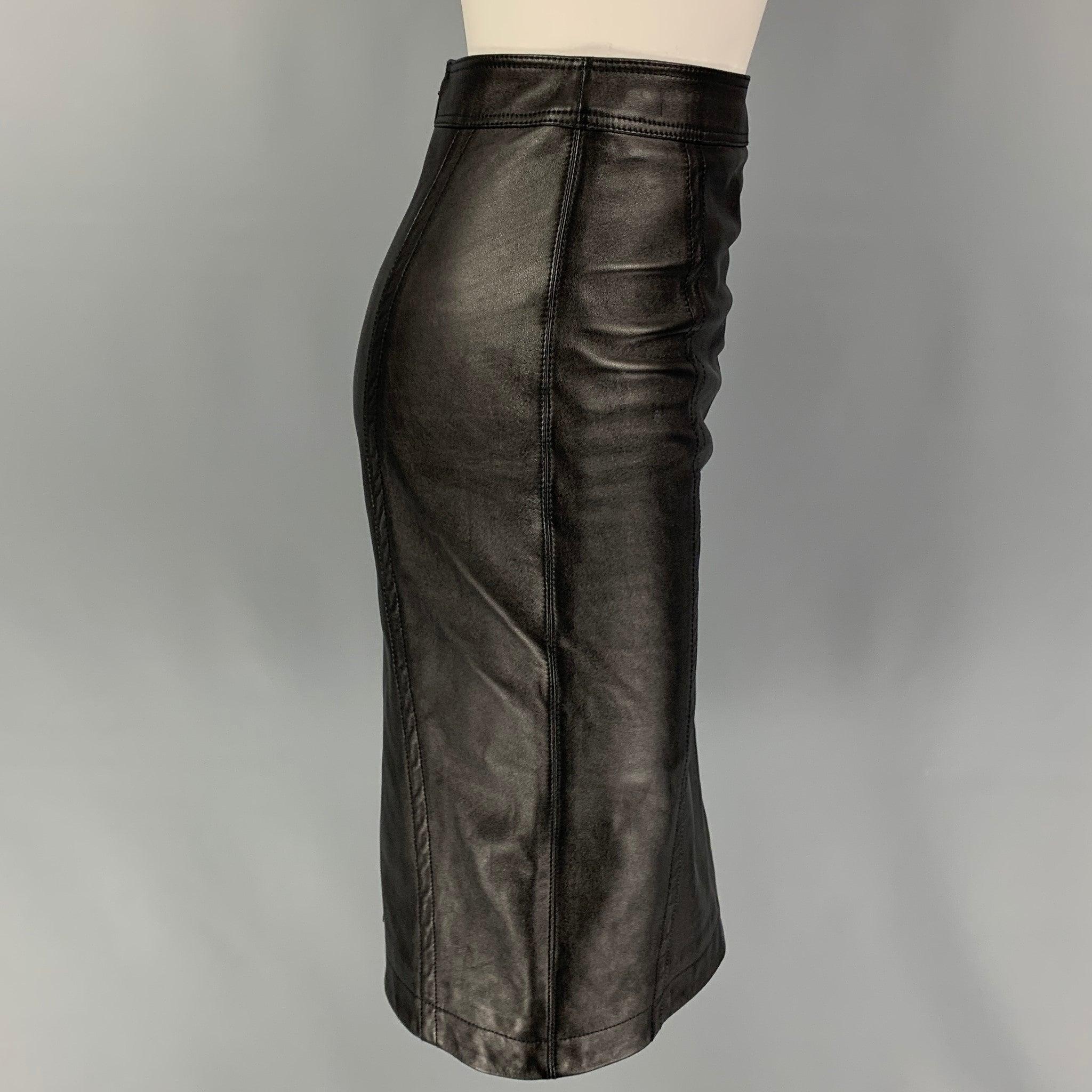 SAINT LAURENT skirt comes in a black lamb skin leather featuring a pencil style, back slit, and a back zip up closure. Made in Italy.
Very Good
Pre-Owned Condition. 

Marked:   F 34 

Measurements: 
  Waist: 24 inches  Hip: 34 inches  Length: 25