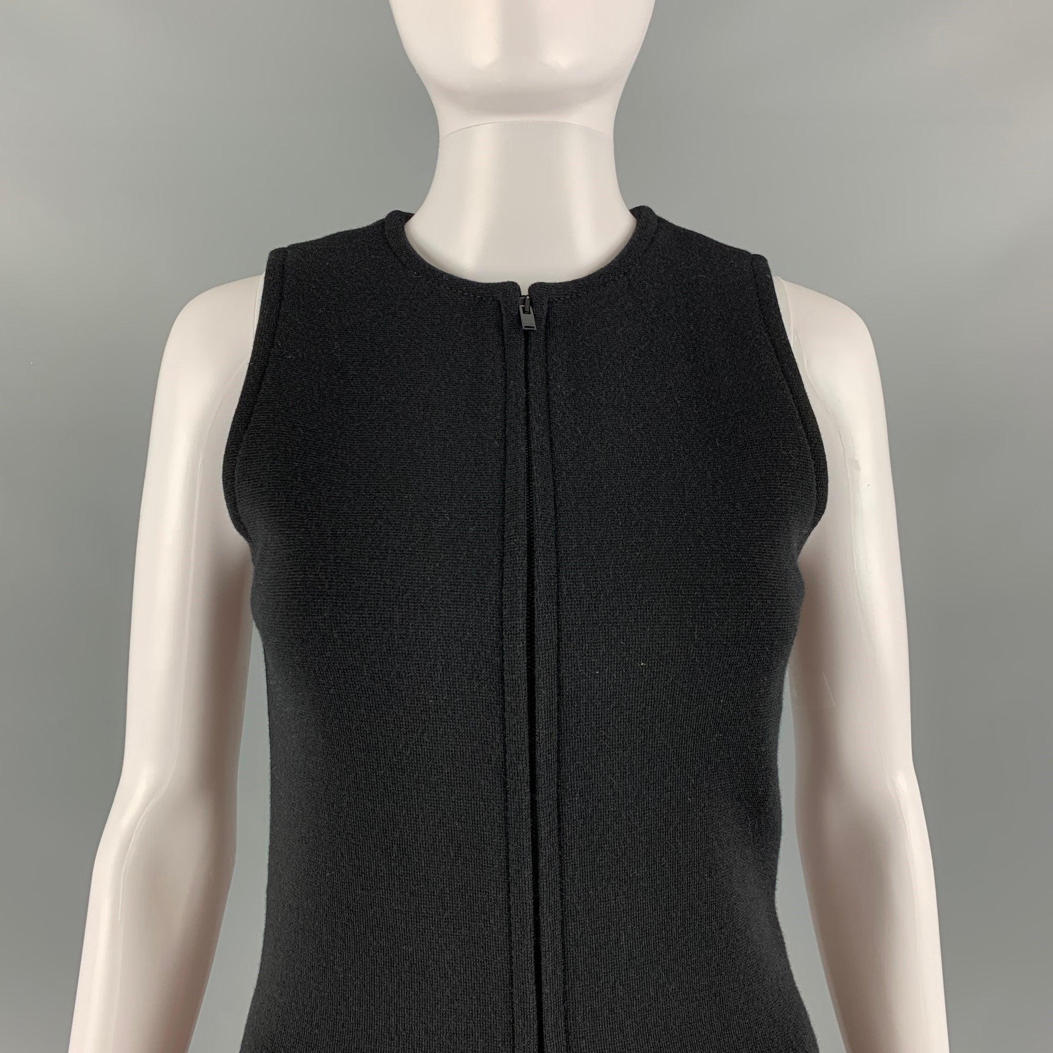 SAINT LAURENT jumpsuit comes in black wool blend knit material featuring a
 sleeveless style, and half zip up front closure. Made in Italy.Very Good Pre-Owned Condition. Minor signs of wear. 

Marked:   34 

Measurements: 
  Bust: 31 inches Waist: