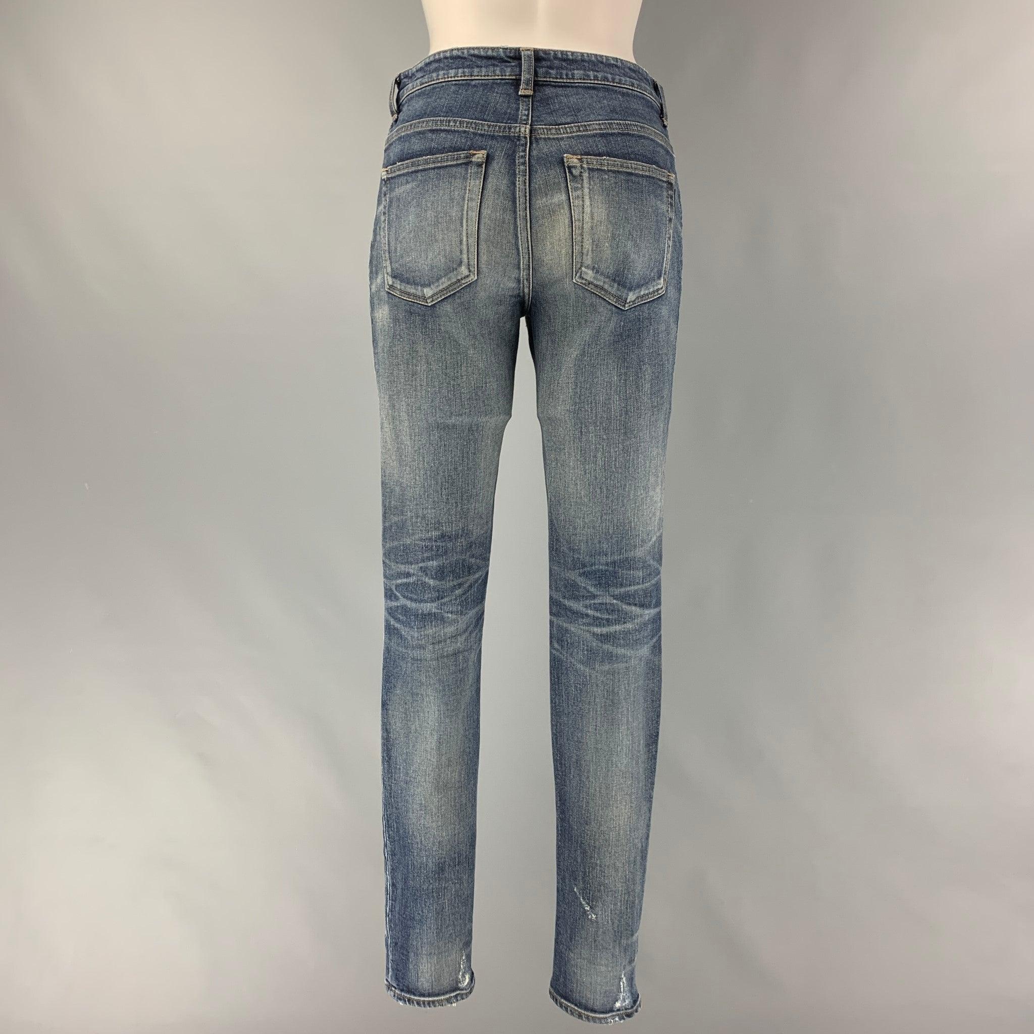 SAINT LAURENT Size 26 Blue Cotton &  Elastane Distressed Skinny Jeans In Good Condition For Sale In San Francisco, CA
