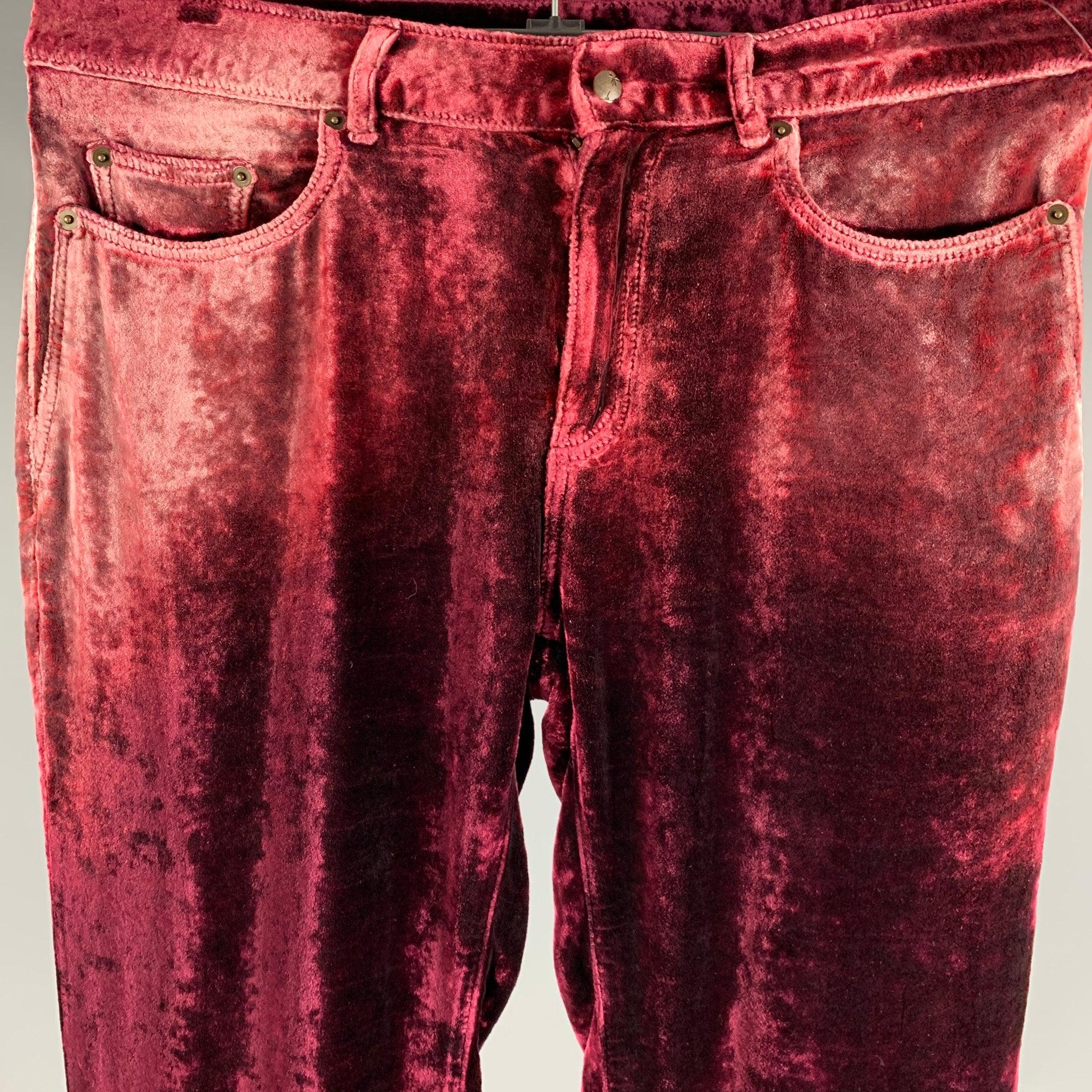 SAINT LAURENT casual pants in
a burgundy velvet viscose silk blend featuring featuring a jean cut and a zip fly closure. Made in ItalyVery Good Pre-Owned Condition. 

Marked:   size not marked 

Measurements: 
  Waist: 33 inches Rise: 9 inches