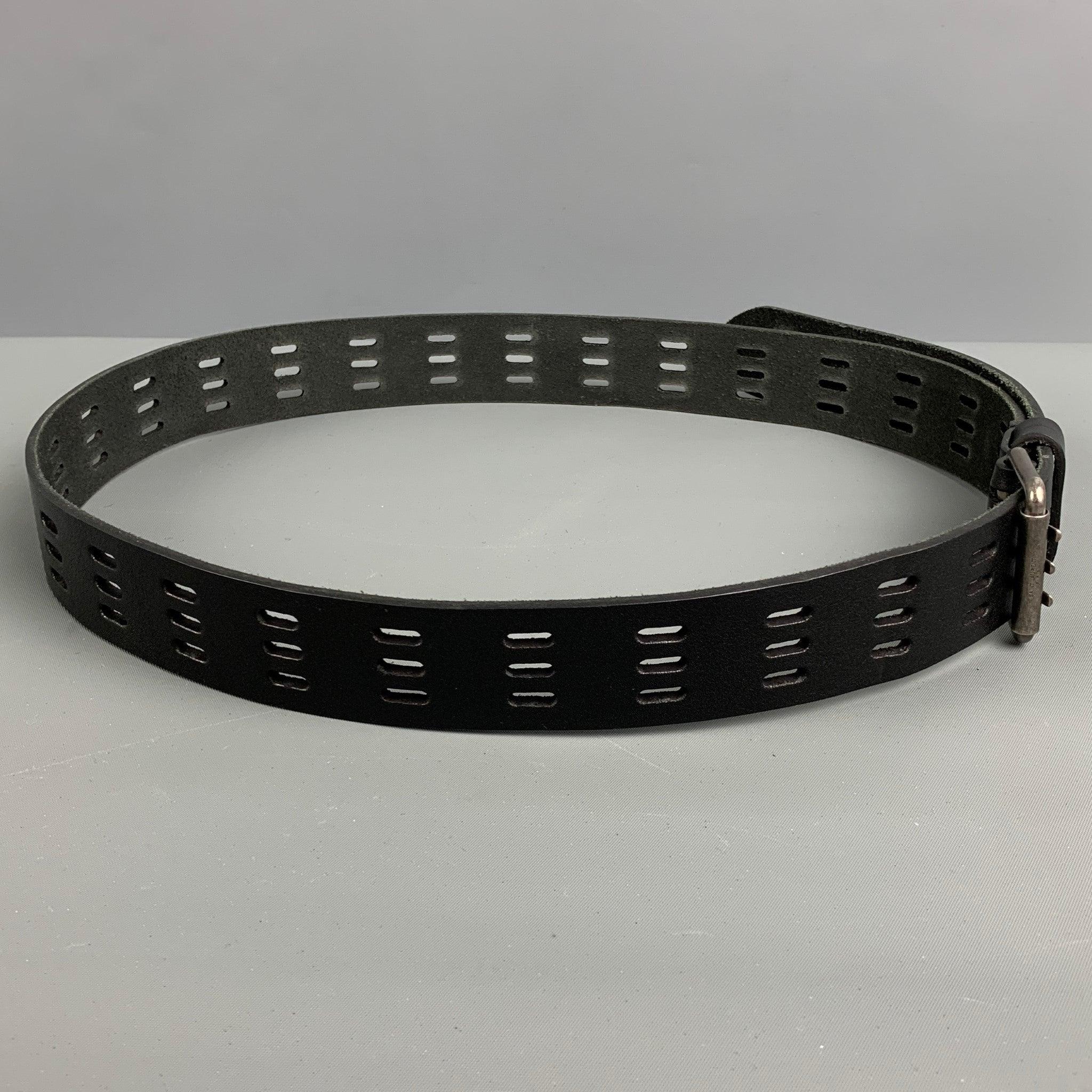 SAINT LAURENT belt comes in a black leather featuring a silver tone with three prong buckle and perforated style. Very Good Pre-Owned Condition.
Minor signs of wear. 

Marked:  
Length: 44 inches Width: 1.5 inches Buckle: 1.5 inches 

  
  
