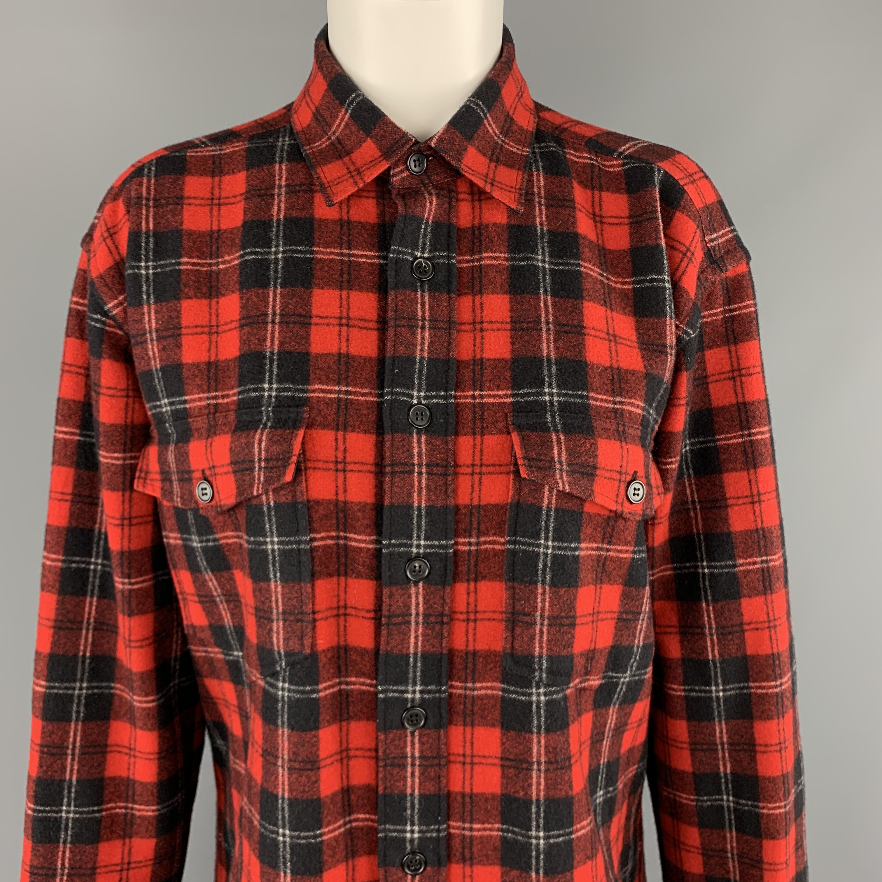 SAINT LAURENT shirt comes in red and black plaid flannel with a pointed collar, oversized fit, and patch flap pockets. Made in Italy.

Excellent Pre-Owned Condition.
Marked: F 36

Measurements:

Shoulder: 18 in.
Bust: 44 in.
Sleeve: 23.5 in.
Length: