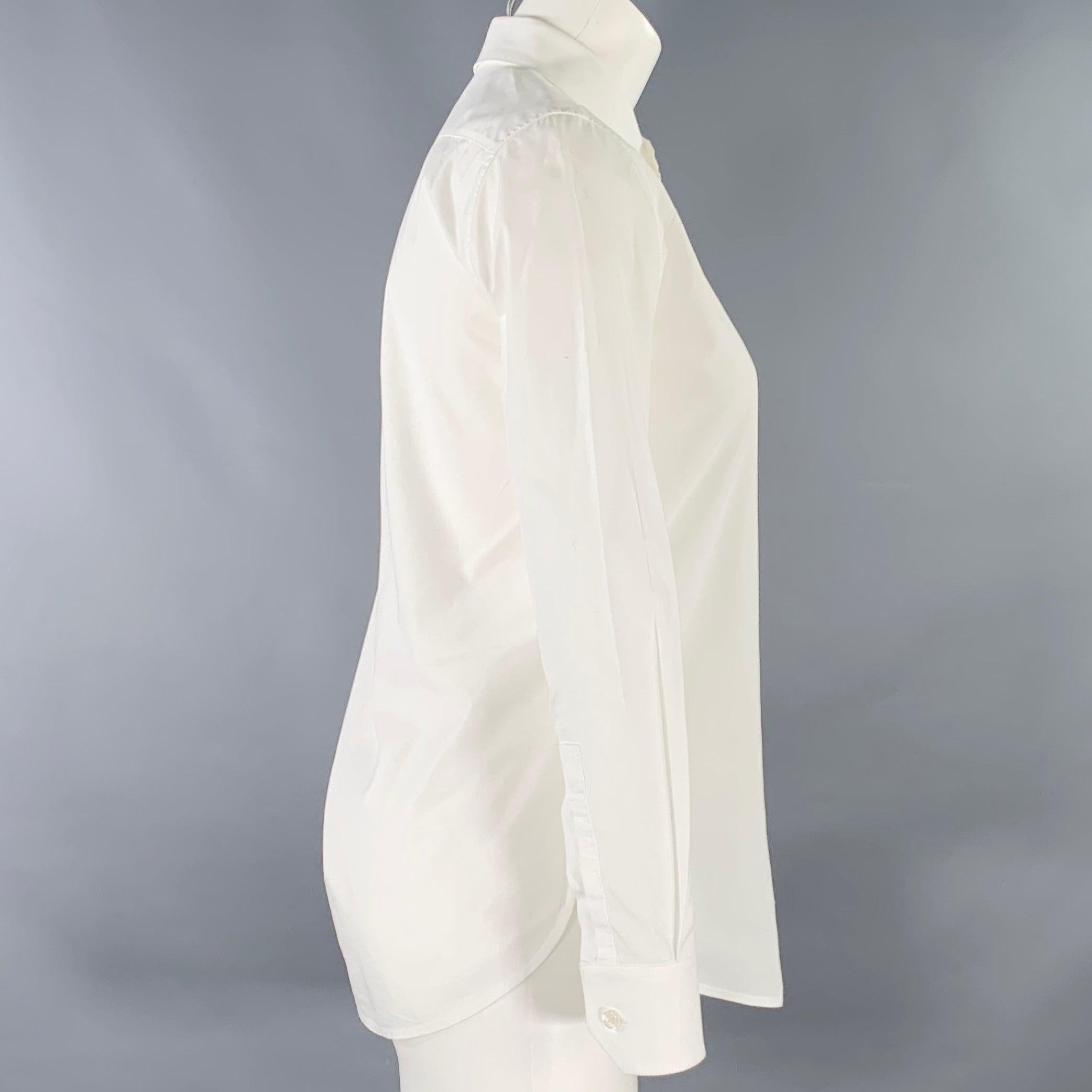 SAINT LAURENT shirt
in a white cotton woven fabric featuring spread collar, and button closure. Made in Italy.Very Good Pre-Owned Condition. Minor mark. 

Marked:   FR 36 

Measurements: 
 
Shoulder: 14 inches Bust: 33 inches Sleeve: 22 inches