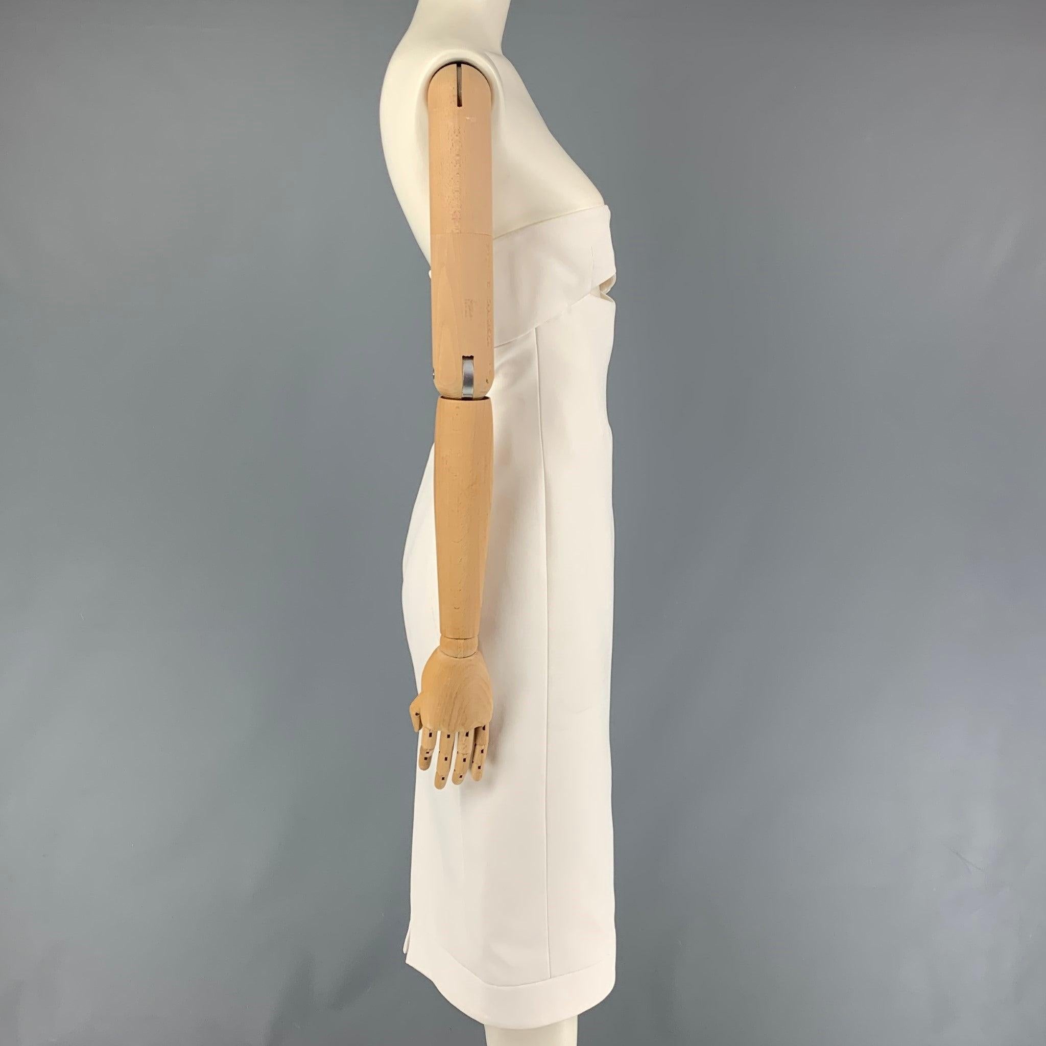 SAINT LAURENT cocktail dress comes in a white viscose featuring a cutout front, strapless neckline, vented back, midi length, and a back zip up closure. Made in Italy.
Very Good
Pre-Owned Condition. 

Marked:   F 36 

Measurements: 
  Bust:
26