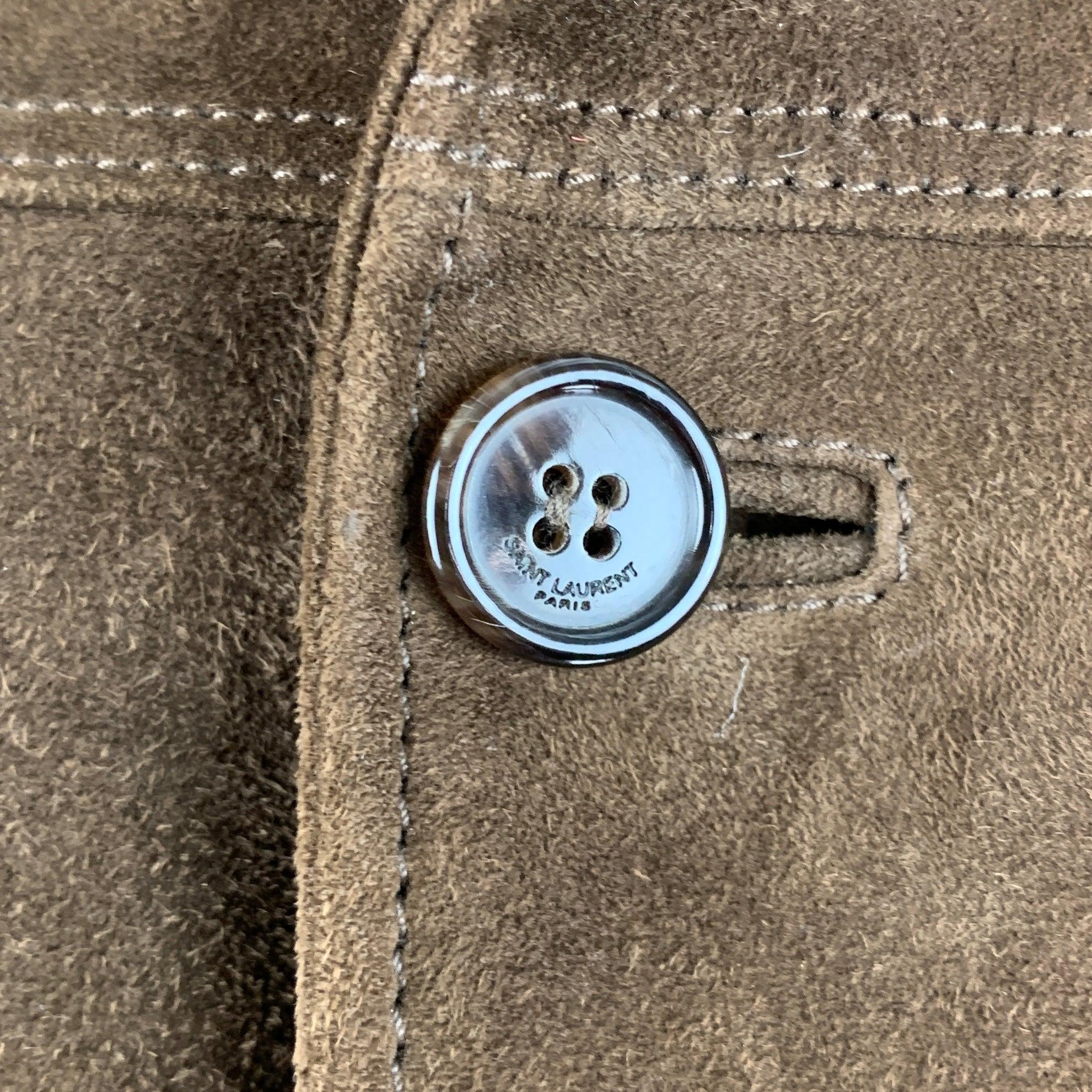 SAINT LAURENT jacket
in a brown suede fabric lined in silk featuring epaulettes, four pockets, and button closure. Made in Italy.Very Good Pre-Owned Condition. Moderate signs of wear. 

Marked:   54 

Measurements: 
 
Shoulder: 17.5 inches Chest: 44