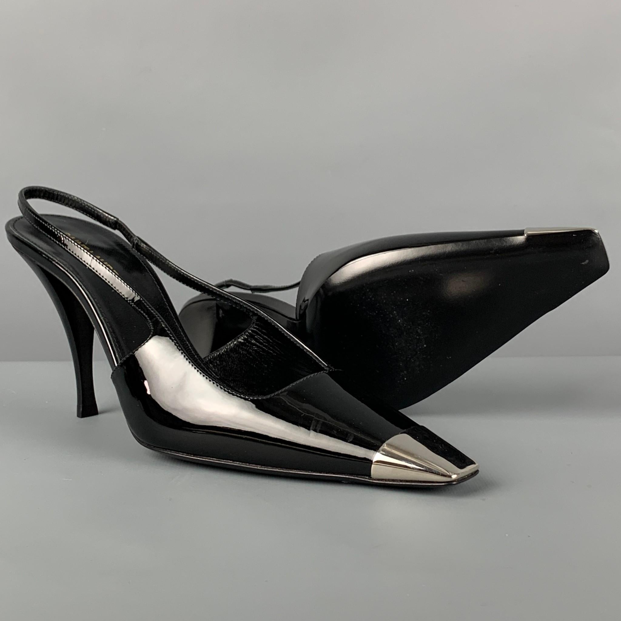 SAINT LAURENT 'Vesper' pumps comes in a black patent leather featuring a square metallic toe, slingback style, and a stiletto heel. Made in Italy. 

Excellent Pre-Owned Condition.
Marked: 37.5
Original Retail Price: $795.00

Measurements:

Heel: 3.5