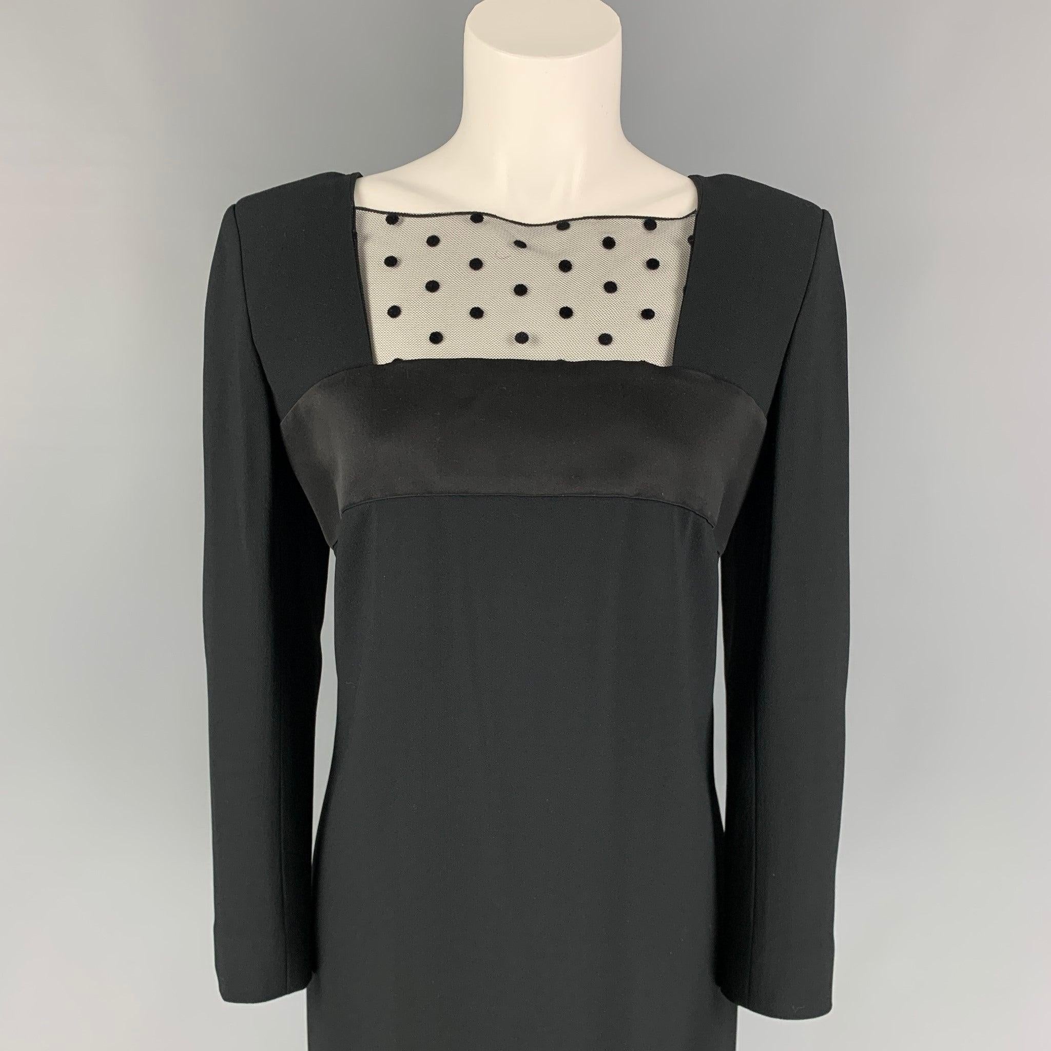 SAINT LAURENT dress comes in a black acetate blend featuring a satin trim, lace panel, buttoned sleeves, and a back zip up closure. Made in France.
Very Good
Pre-Owned Condition. 

Marked:   F 40 

Measurements: 
 
Shoulder: 16.5 inches  Bust: 36