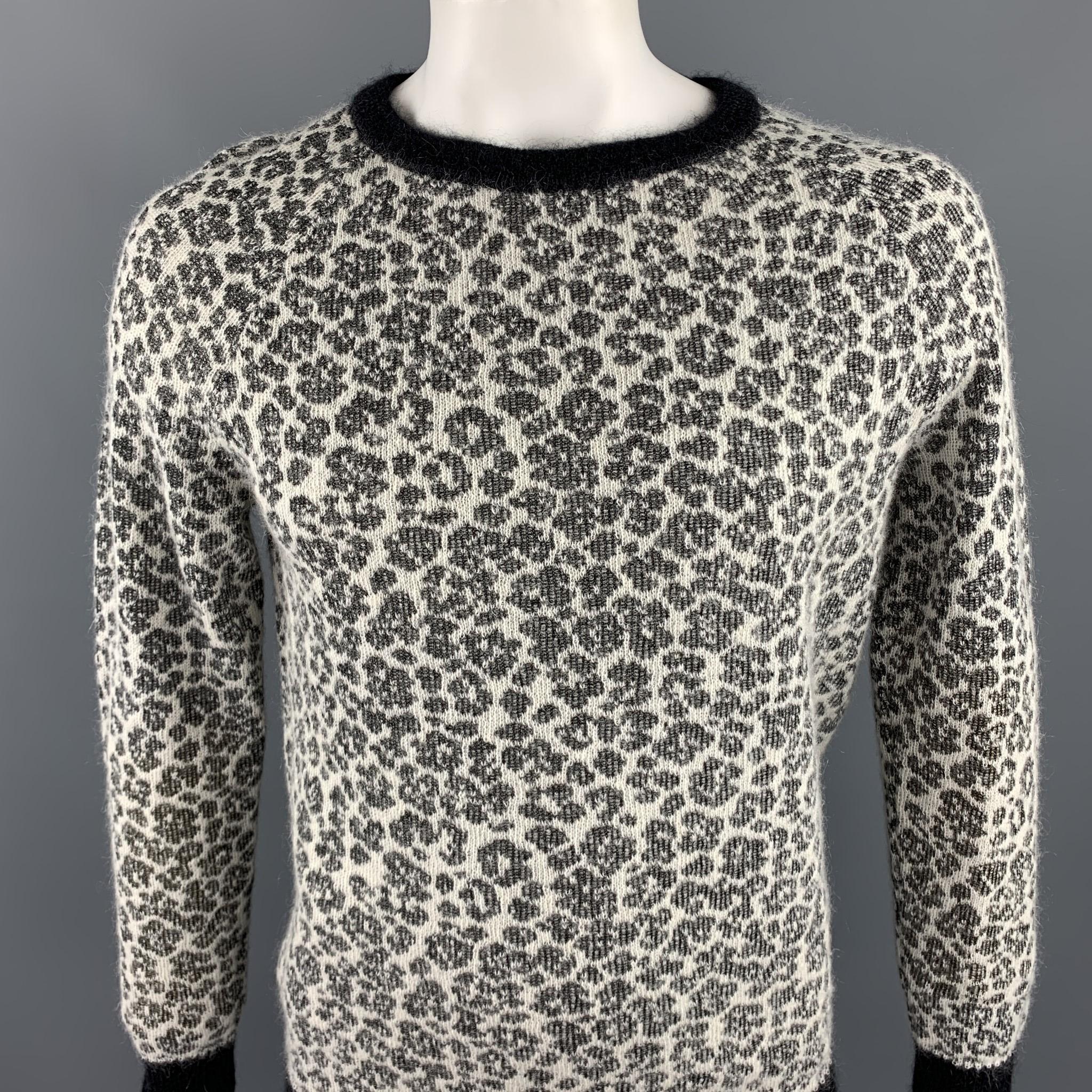SAINT LAURENT sweater coms in a black & white leopard print mohair blend featuring a ribbed loose neckline. Made in Italy.

Excellent Pre-Owned Condition.
Marked: L

Measurements:

Shoulder: 18 in. 
Chest: 40 in. 
Sleeve: 28 in. 
Length: 27 in. 