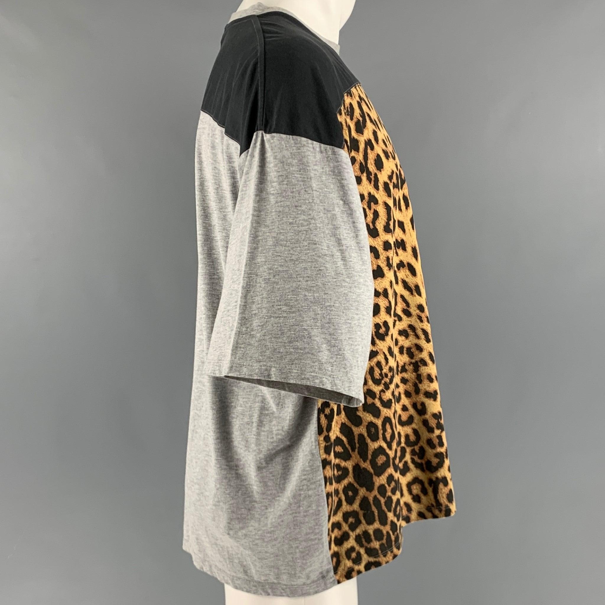SAINT LAUREN t-shirt
in a black, grey, and brown cotton fabric featuring animal print front panel, and crew neck. Made in Italy.Very Good Pre-Owned Condition. Minor mark and signs of wear, as is. 

Marked:   M 

Measurements: 
 
Shoulder: 25 inches