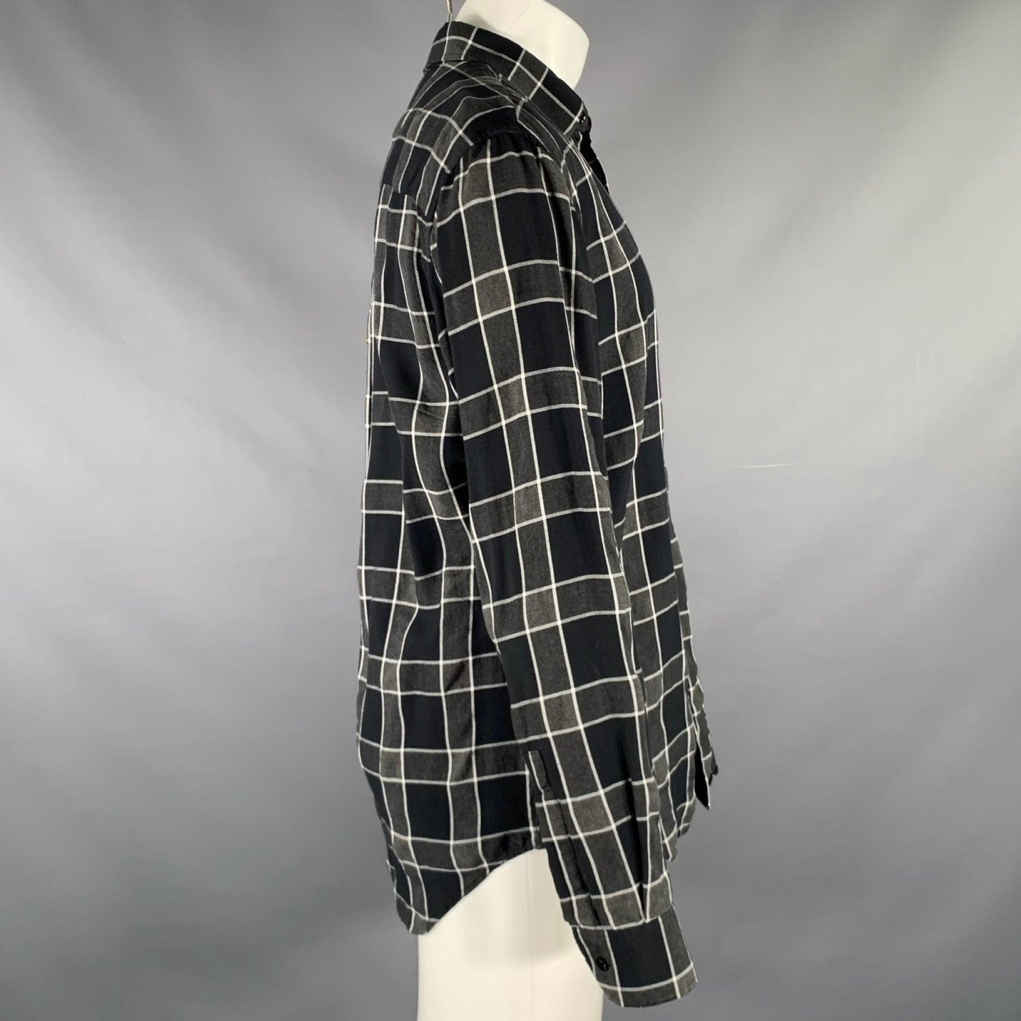 SAINT LAURENT long sleeve shirt
in a grey, black & white tencel viscose blend fabric featuring a plaid pattern, one pocket, and button closure. Made in Italy.Excellent Pre-Owned Condition. 

Marked:   41/16 

Measurements: 
 
Shoulder: 18 inches