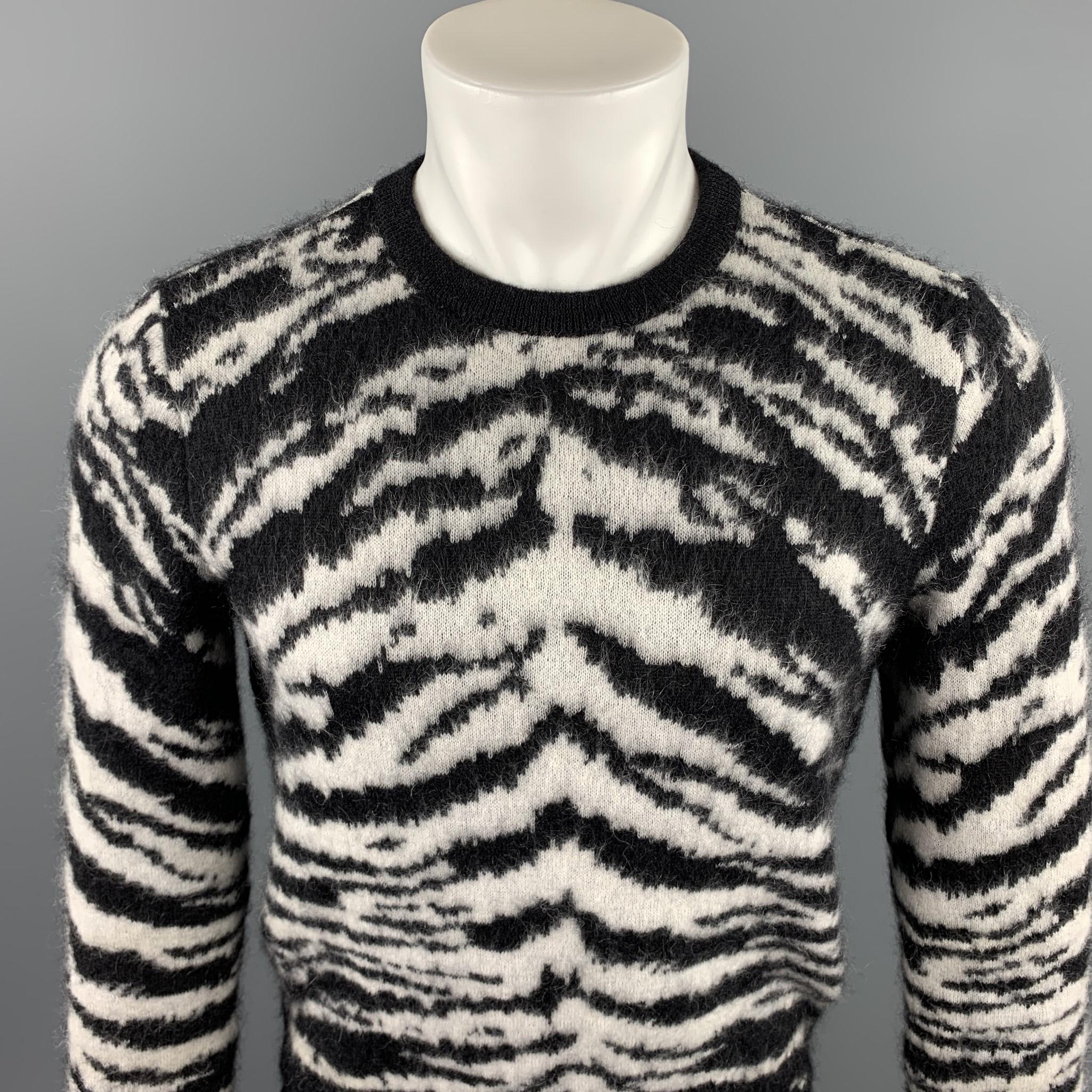 SAINT LAURENT sweater comes in a black & white zebra mohair blend featuring a ribbed crew-neck. Made in Italy.

Excellent Pre-Owned Condition.
Marked: S
Original Retail Price: $1,350.00

Measurements:

Shoulder: 17 in. 
Chest: 38 in. 
Sleeve: 26 in.