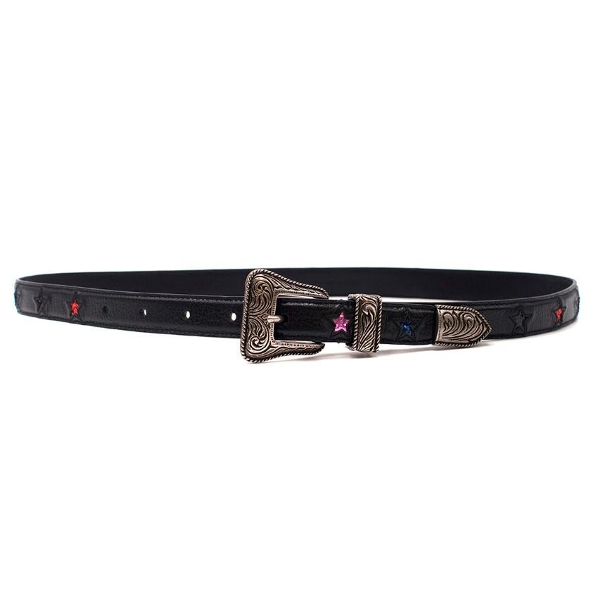 Saint Laurent Skinny Leather Star Patch Western Belt

- Black skinny leather belt
- Western style buckle
- Silver-tone hardware
- Multi-coloured glitter star detailing

Please note, these items are pre-owned and may show some signs of storage, even