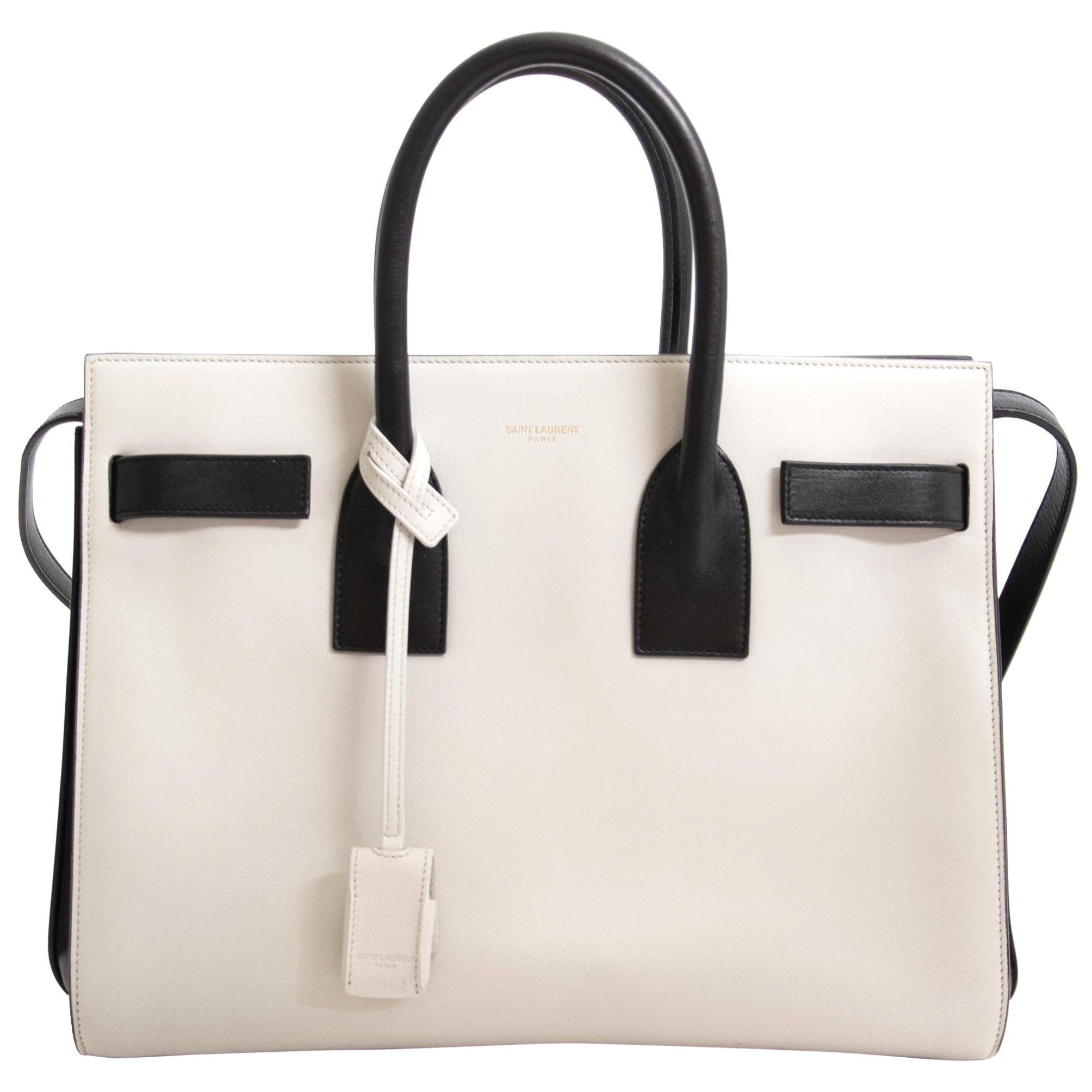 Excellent condition

Saint Laurent Small Bicolor Black/White Sac De Jour

The amazing Sac De Jour from Saint Laurent is crafted in premium leather, of smooth calfskin and comes in black and white. 
There's a foil Saint Laurent logo at center front.
