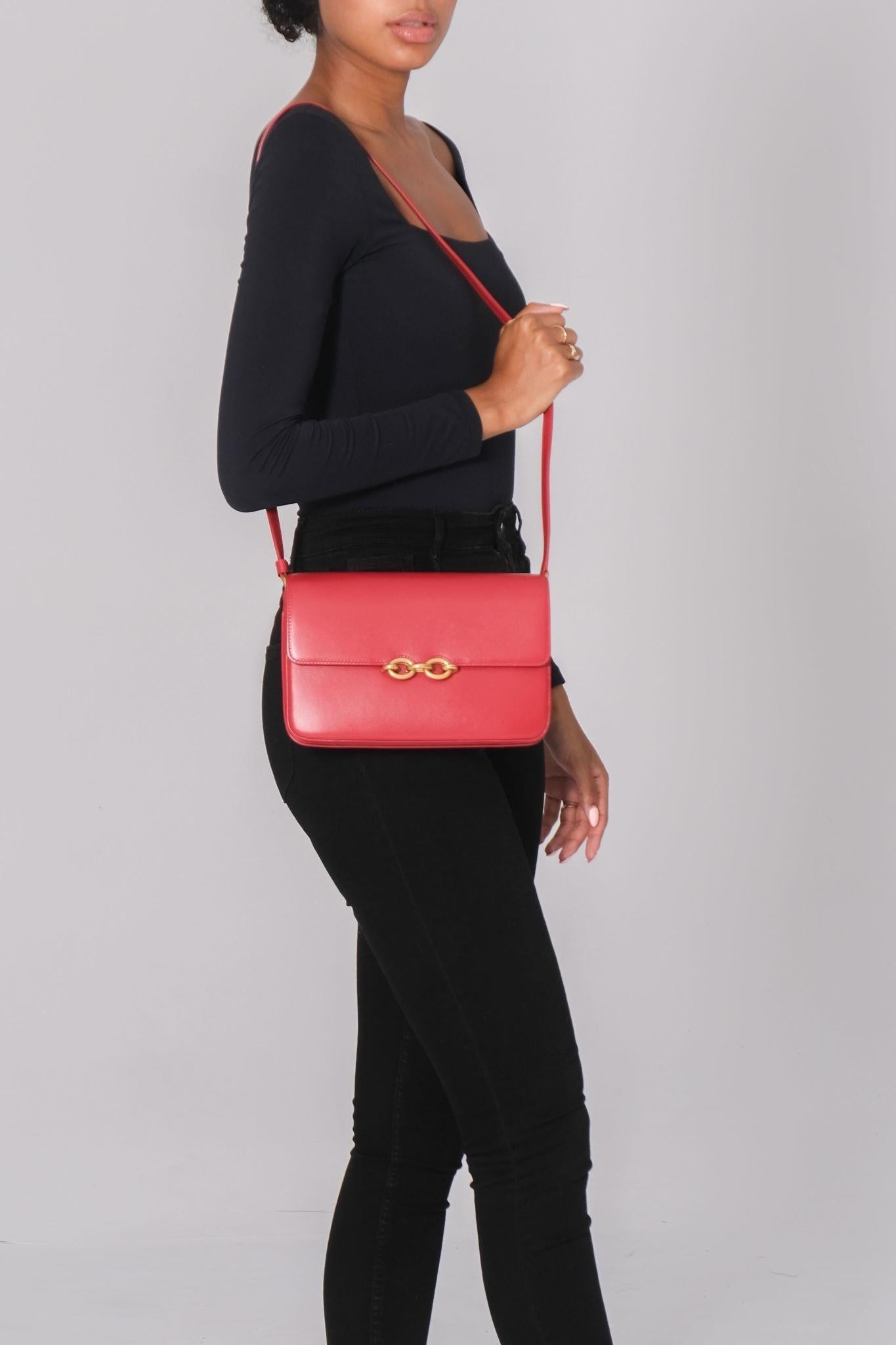 Color: red
Material: leather
Model No. 649795
Comes with: dust bag
Condition: Excellent. Faint hairline scratches.
Made in Italy

Measurements~
Height 6.5”
Width 9.5”
Depth 2”
Drop 21”

retail