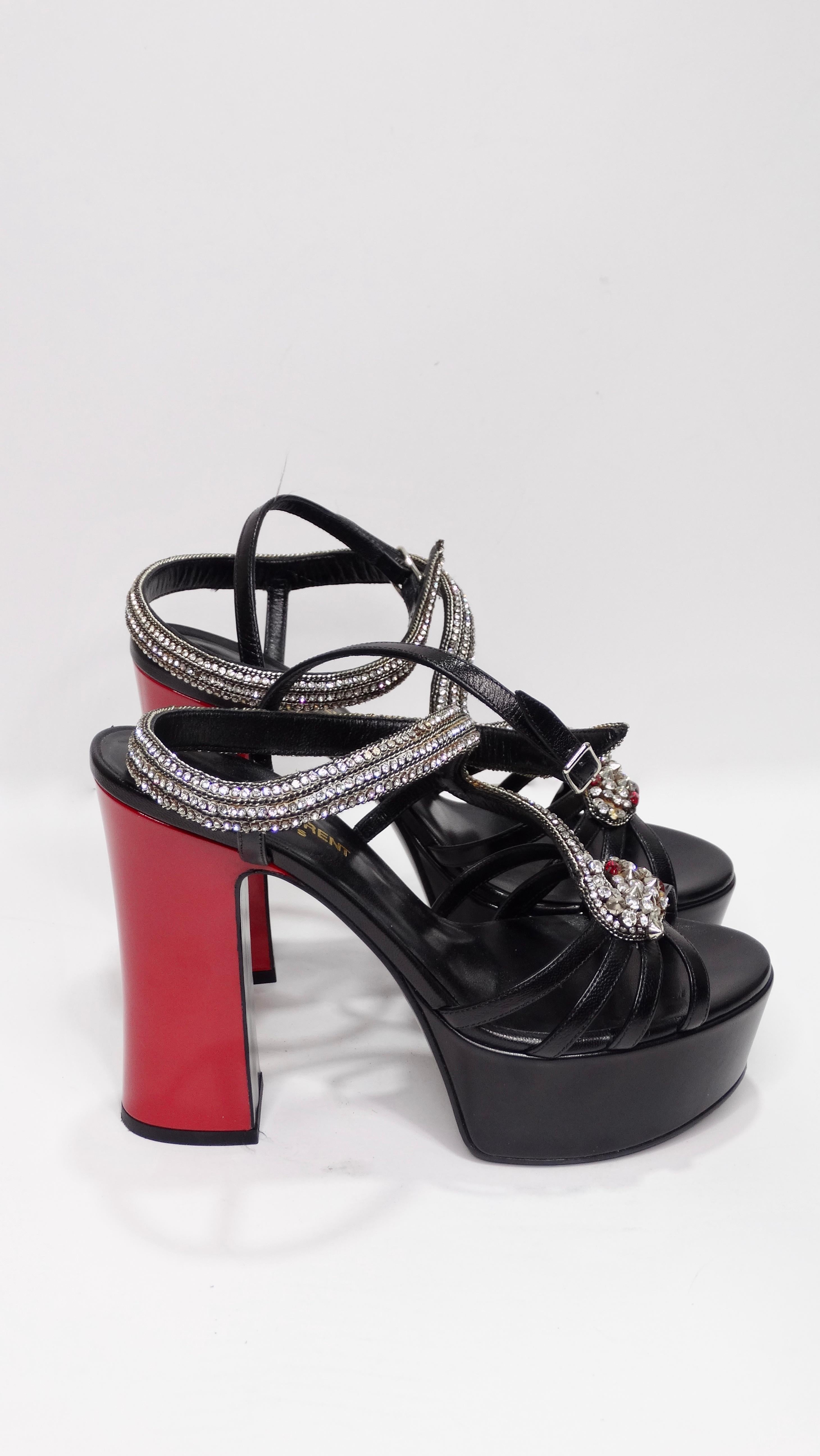 Add these killer heels to your collection! Circa mid to recent 2000's, these hot platforms are sure to steal the show. Complete with embellished crystal snakes with red eyes, crystal and black leather straps, and a red heel these stunning heels will