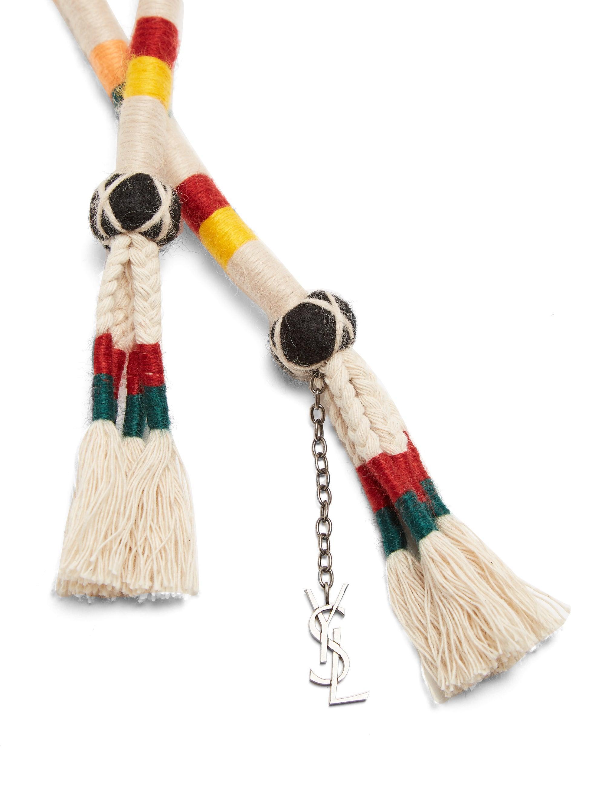 Saint Laurent SS18 Beige Rope Belt w/ Multicolor Stripes & YSL Logo Charm

Saint Laurent's beige rope belt is imbued with a 1970s craft-inspired feel. It's trimmed with multicoloured stripes, swishing tassels and a silver-tone metal YSL logo charm,