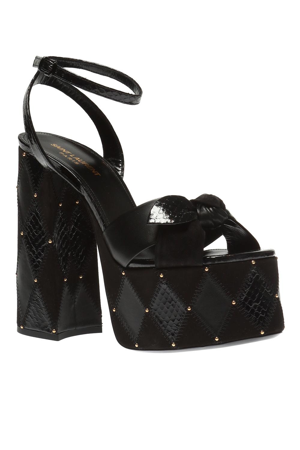 Saint Laurent SS19 Runway Black Leather Suede Paige 85 Platform Sandals

Black ‘Paige’ platform sandals from Saint Laurent. Made of leather. Fastened with a buckle strap. Decorated with an applique in the form of a bow. Heel and platform featuring
