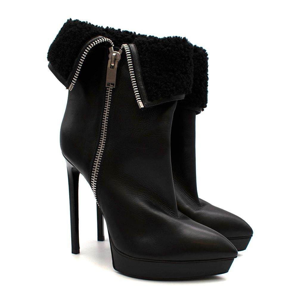 Saint Laurent Stiletto Shearling Lined Platform Boots

- Shearling with leather hemlines
- Textured wet look leather lining
- Silver chunky zip detailing on the outer leg
- Shiny leather outer-sole
- Pointy toe shape
- Platform wedge
- Squared