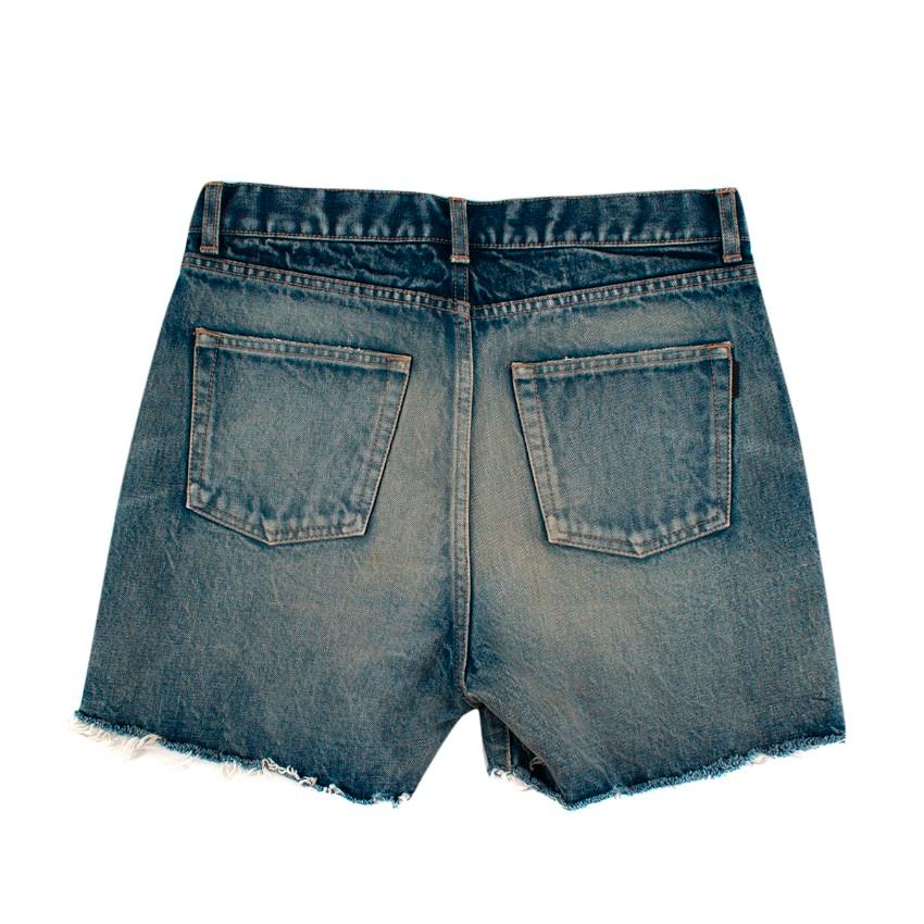 Saint Laurent Stonewashed Mid Blue Denim Cut-Off Shorts
 

 - Non-stretch denim shorts in blue
 - Mid-rise fit
 - Fading, whiskering, and distressing throughout
 - Five-pocket styling, belt loops at waistband
 - Raw edge at cuffs
 - Zip-fly closure