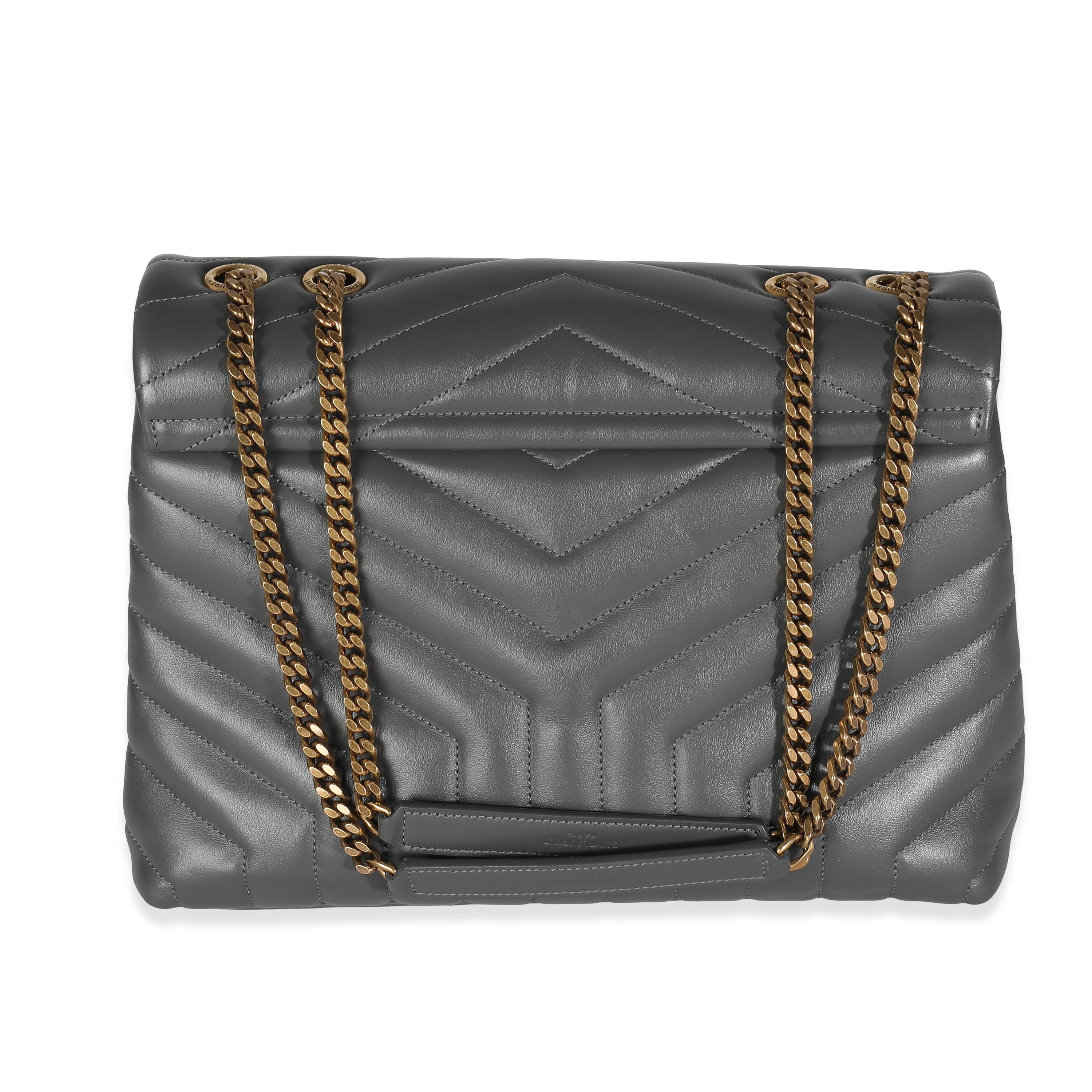 Listing Title: Saint Laurent Storm Grey Calfskin Y Quilted Monogram Medium Loulou
SKU: 139045
MSRP: 2890.00 USD
Condition: Pre-owned 
Condition Description: Named after Loulou de la Falaise, the Loulou bag from Saint Laurent is an ode to one of the