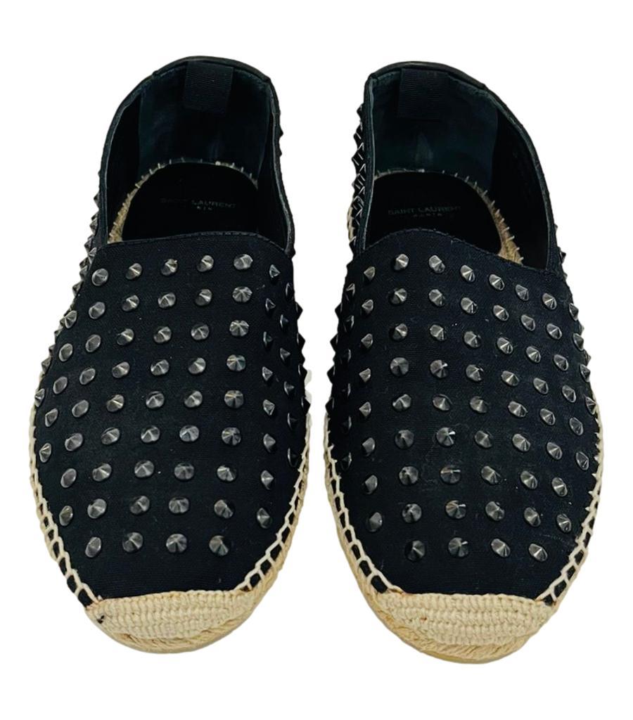 Saint Laurent Studded Canvas Espadrilles

Black espadrilles embellished with all-over round tonal studs.

Detailed with beige braided midsoles, 'Saint Laurent' embossment to the heel and rubber soles.

Size – 41.5

Condition – Very Good (Glue