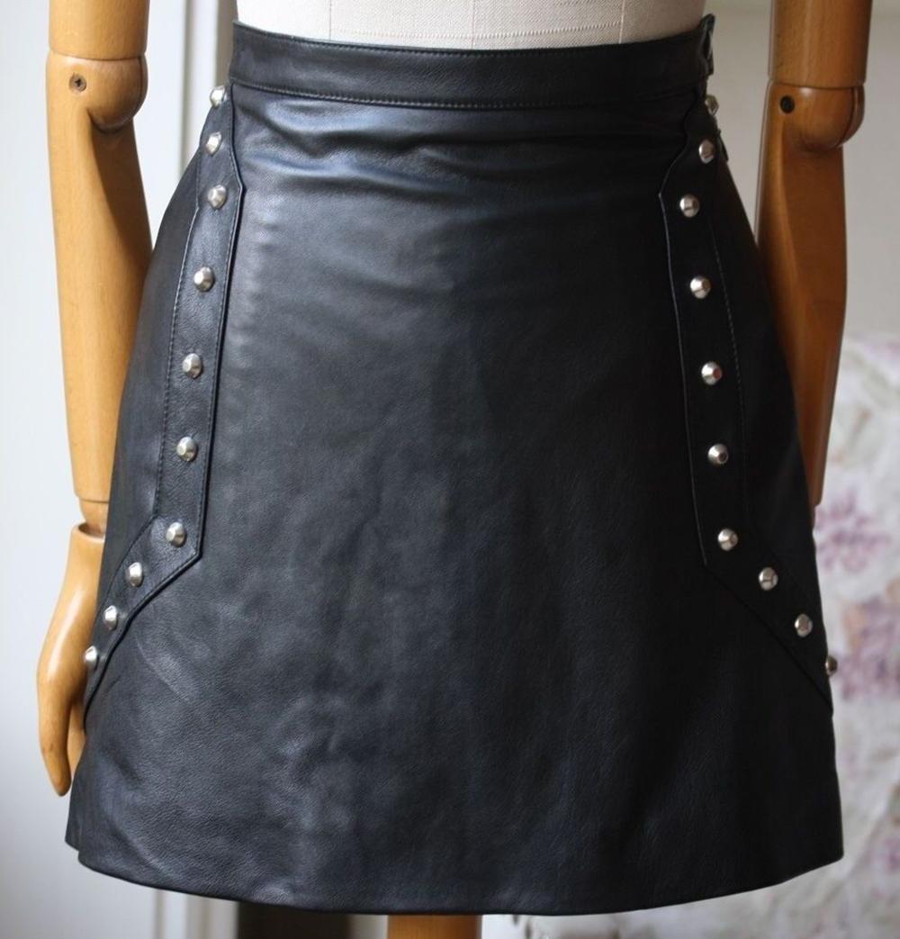 Saint Laurent mini skirt with metal studs and subtle a-line silhouette. Length 16 inches. Silk lining. Tab and side zip closure. Front slash pockets. 100% Lambskin.

Size: FR 36 (UK 8, US 4, IT 40)

Condition: As new condition, no sign of wear. 