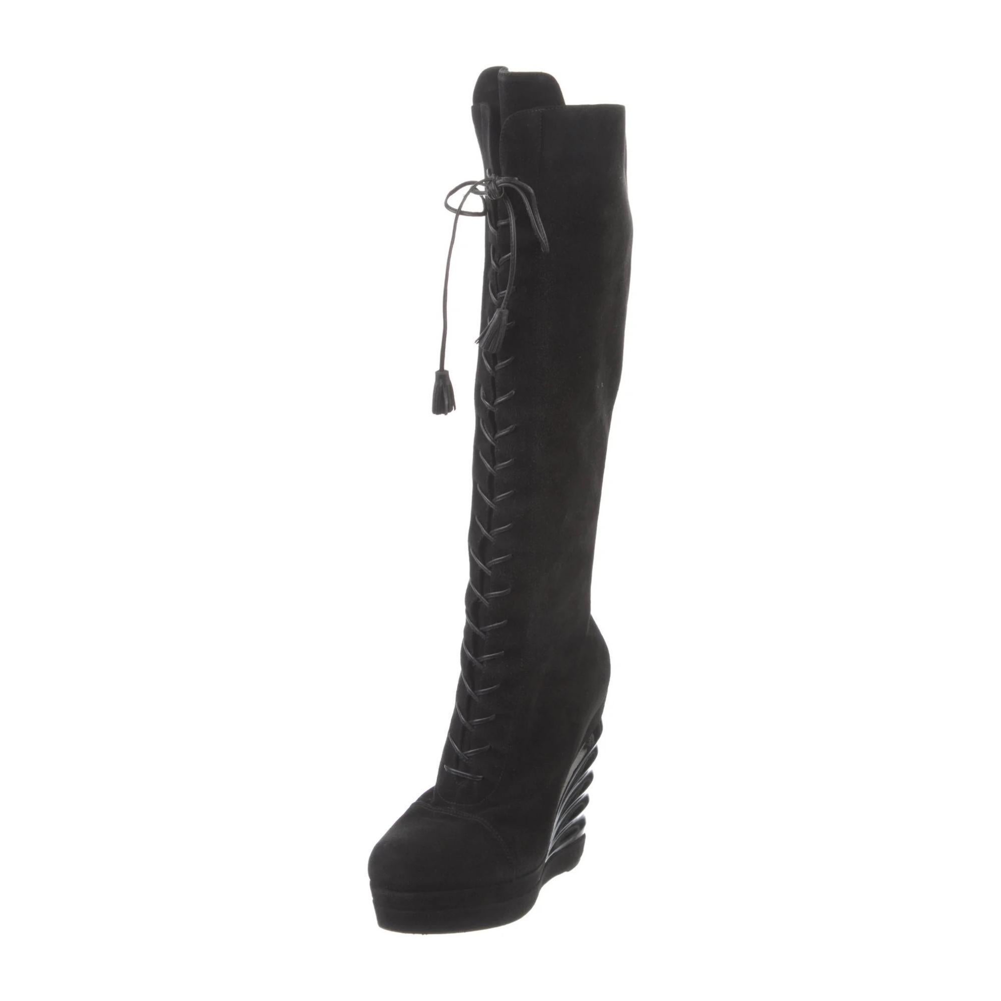Yves Saint Laurent Suede Mid-Calf Lace-Up Boots. Black. Leather Trim. Leather & Tassel Accents. Semi-Pointed Toes. Wedge Heels with Platform. Lace-Up Closure at Uppers & Concealed Zip Closure at Ankles.

COLOR: Black
MATERIAL: Suede
ITEM CODE: